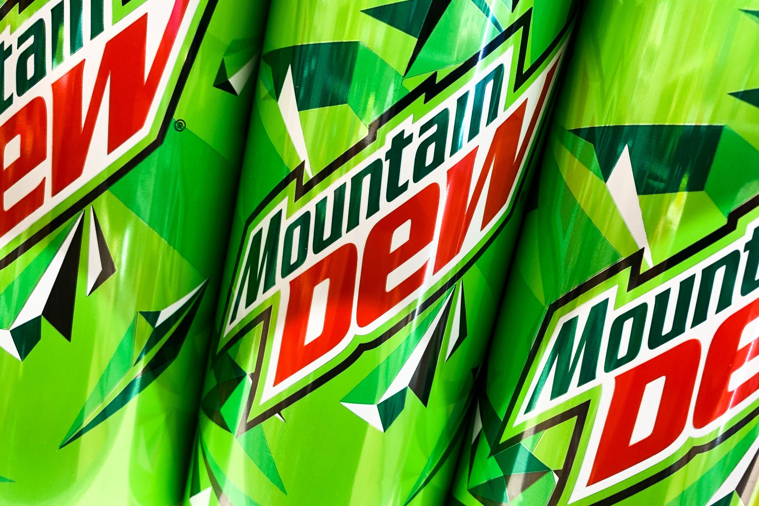 three mountain dew cans close up