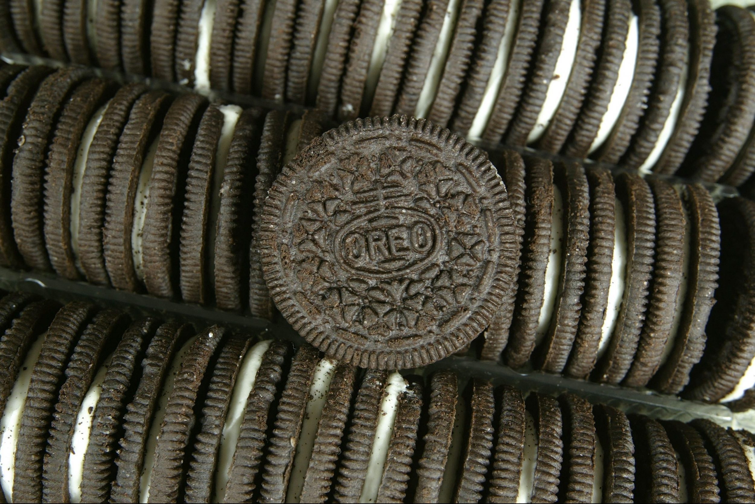 close up of rows of oreos and one oreo on top