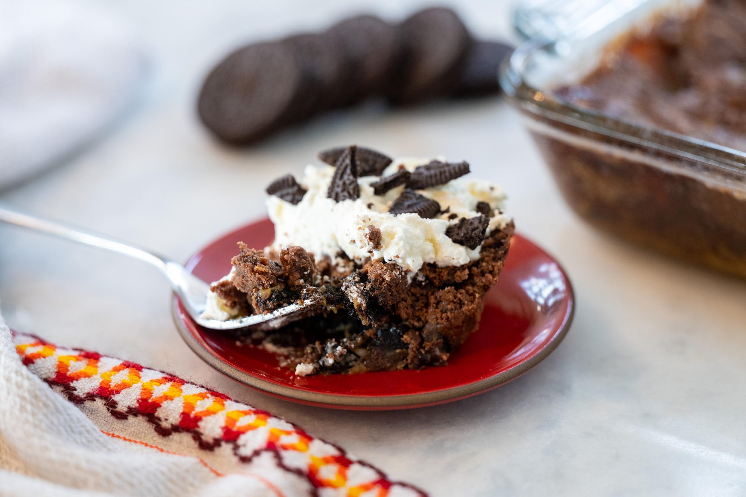 oreo dump cake on a red plate