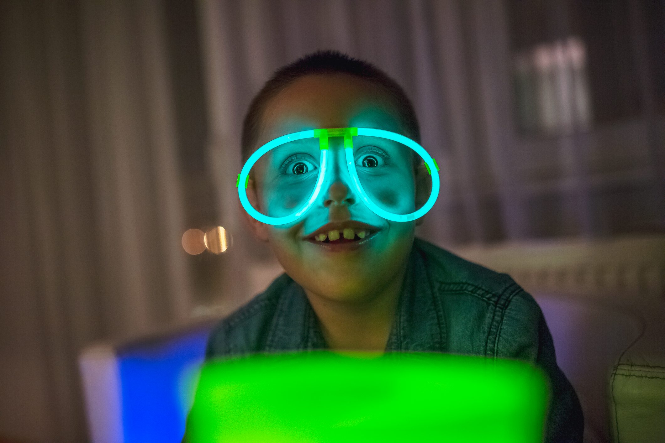 Boy wearing neon eyeglasses