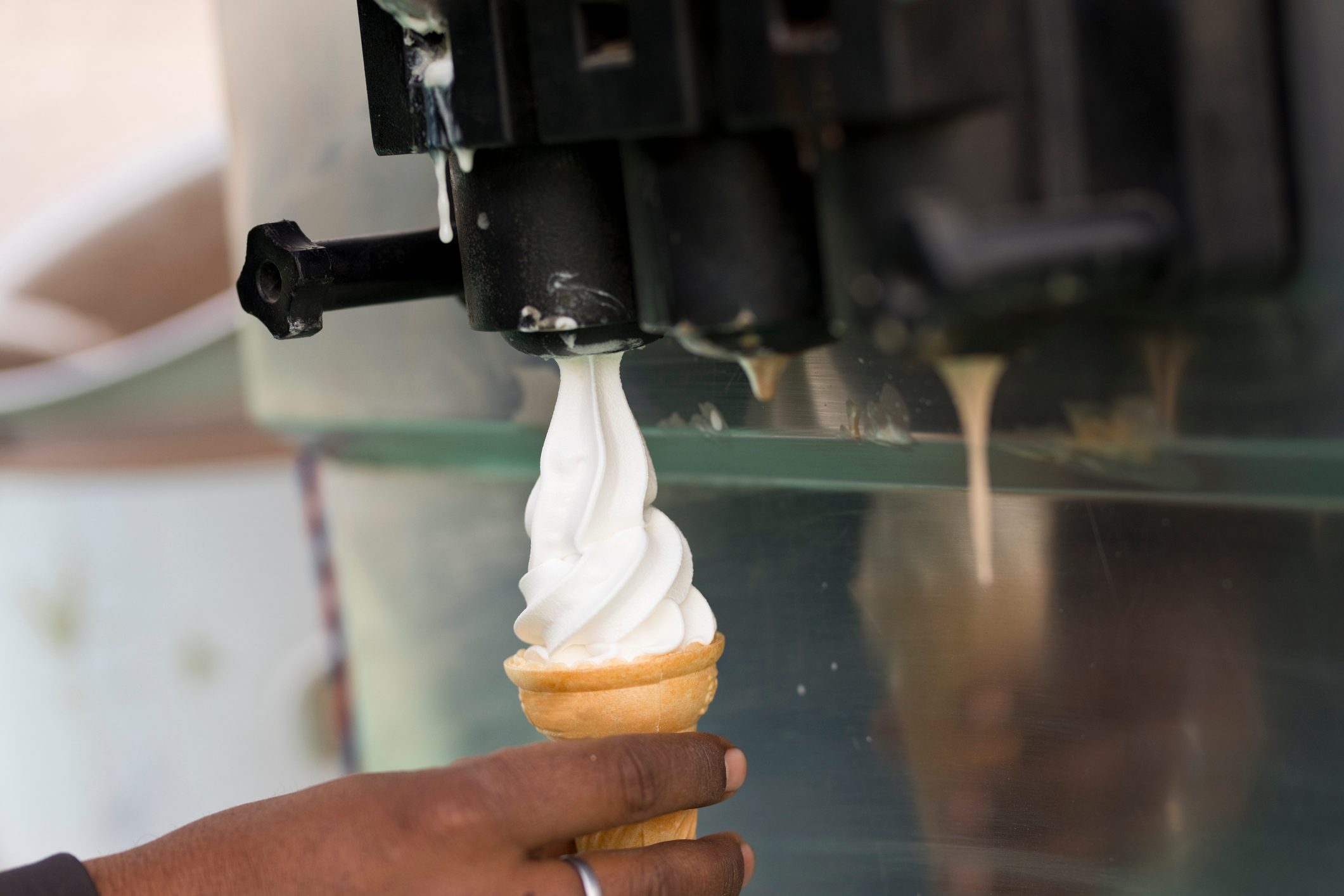 Man filling ice cream cone