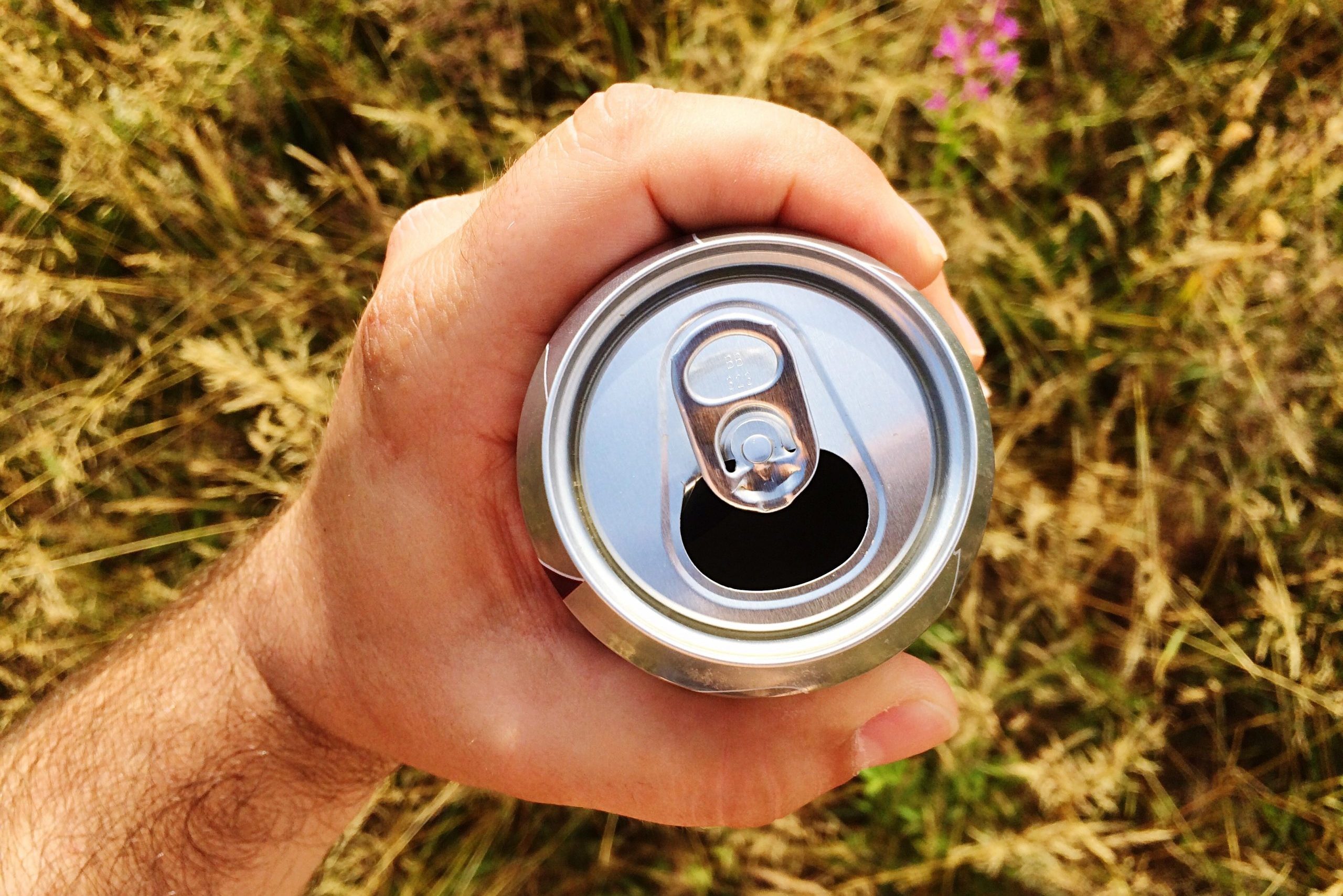 Close-Up Of Man Holding Beer Can