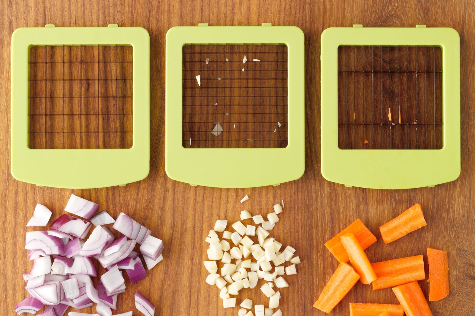 Mueller Vegetable Chopper and three different vegetables chopped