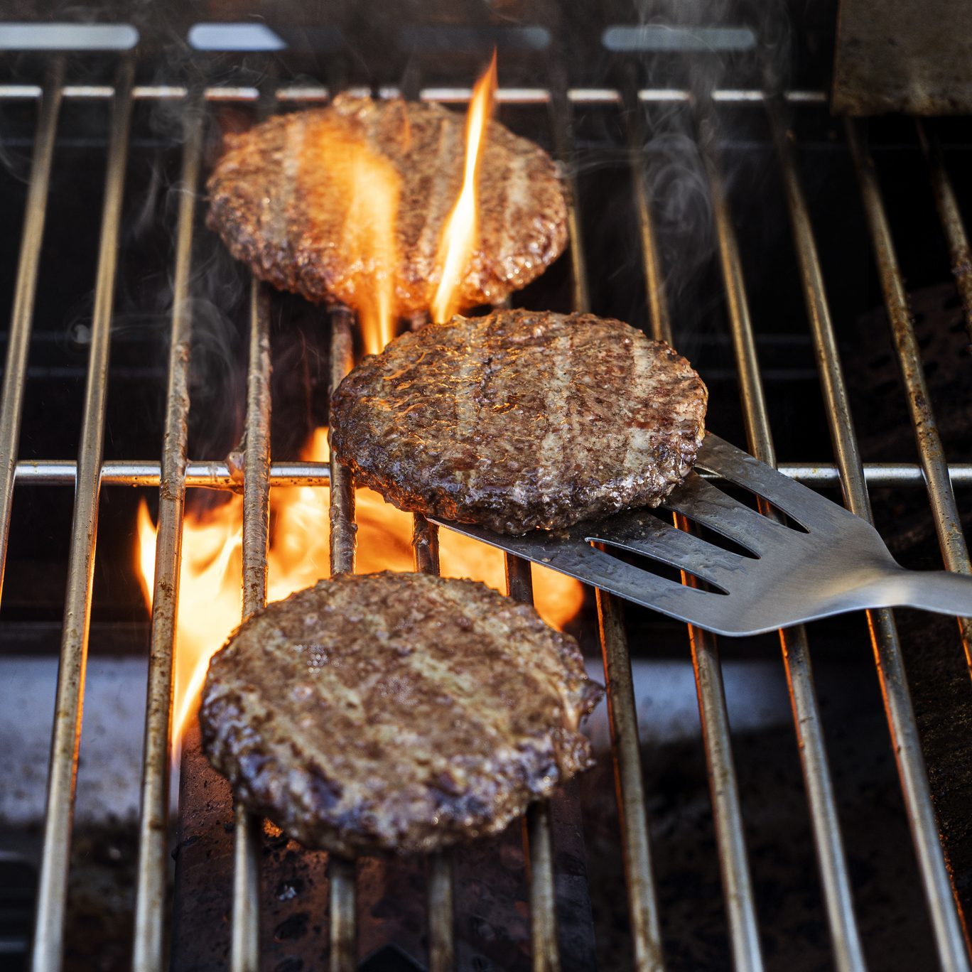 Burgers cooking onbarbecue grill