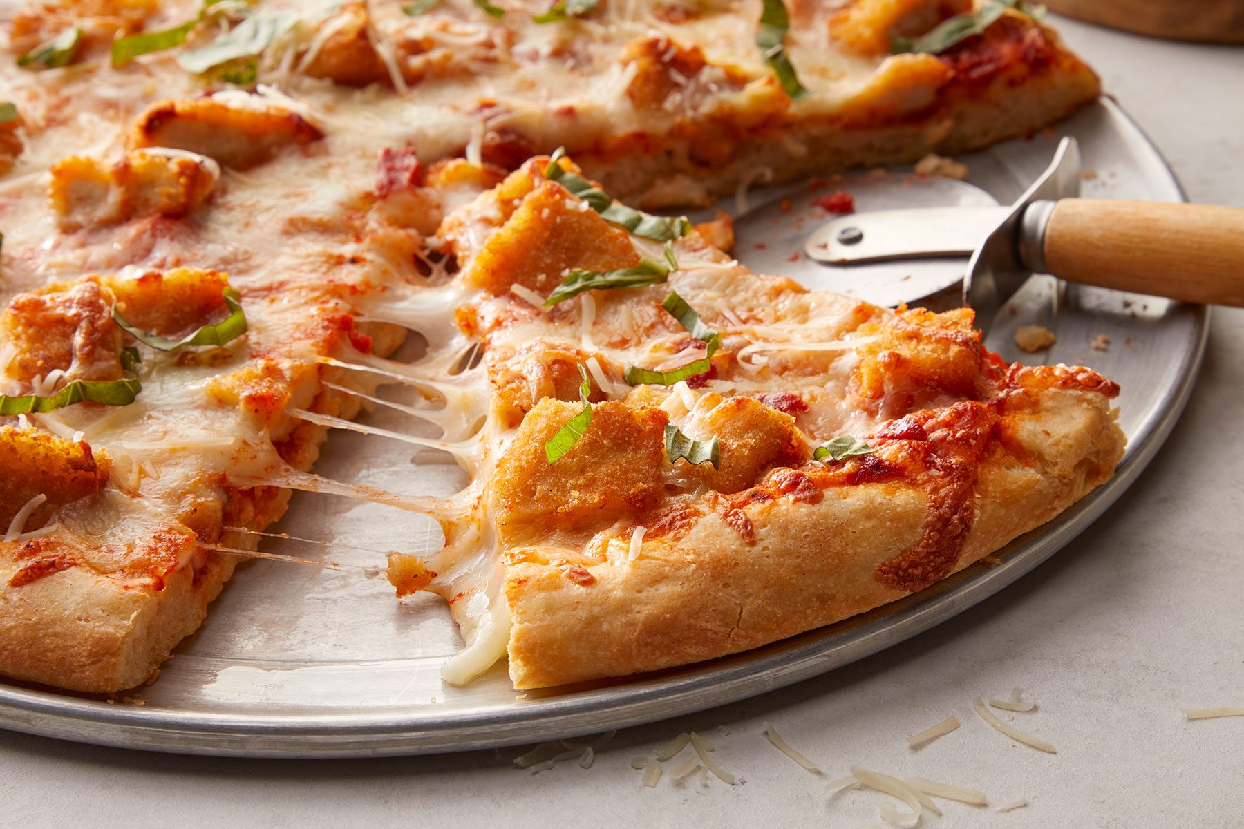 Chicken Parm Pizza with pizza cutter