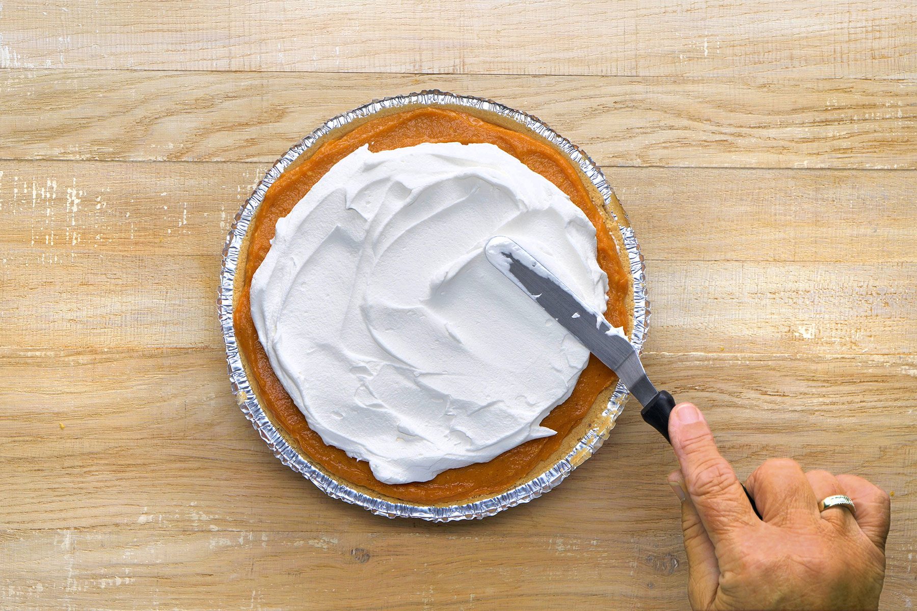 Layering the pie with whipped cream