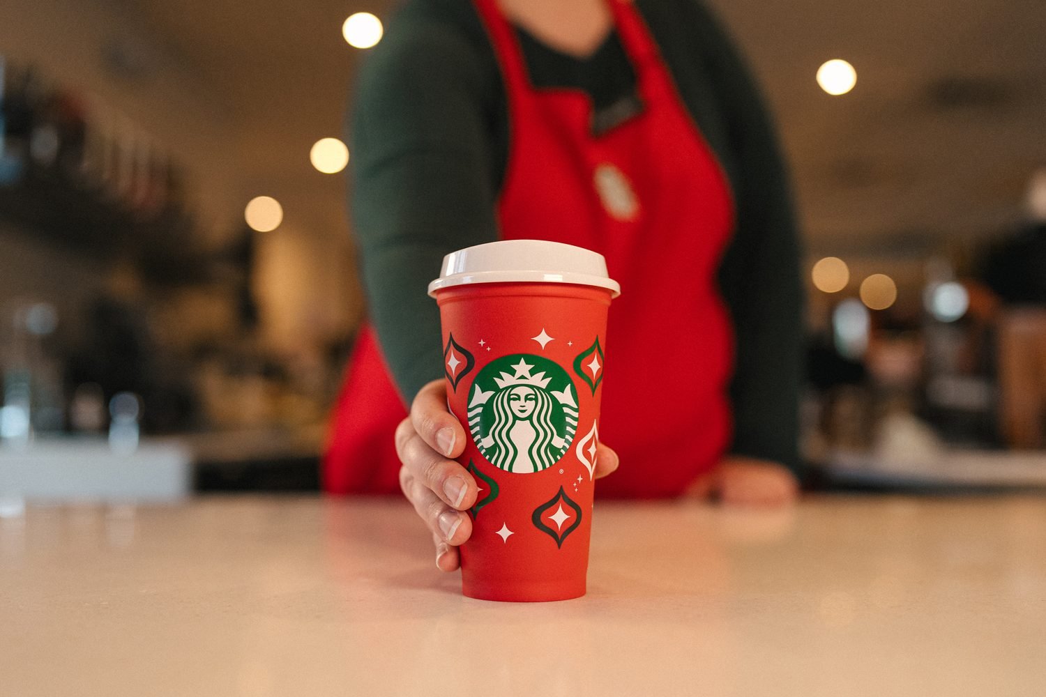 https://www.tasteofhome.com/wp-content/uploads/2023/11/Starbucks-Reusable-Holiday-Red-Cups-2023-Lifestyle-Courtesy-Starbucks-Resize-DH-TOH.jpg?fit=700%2C1000