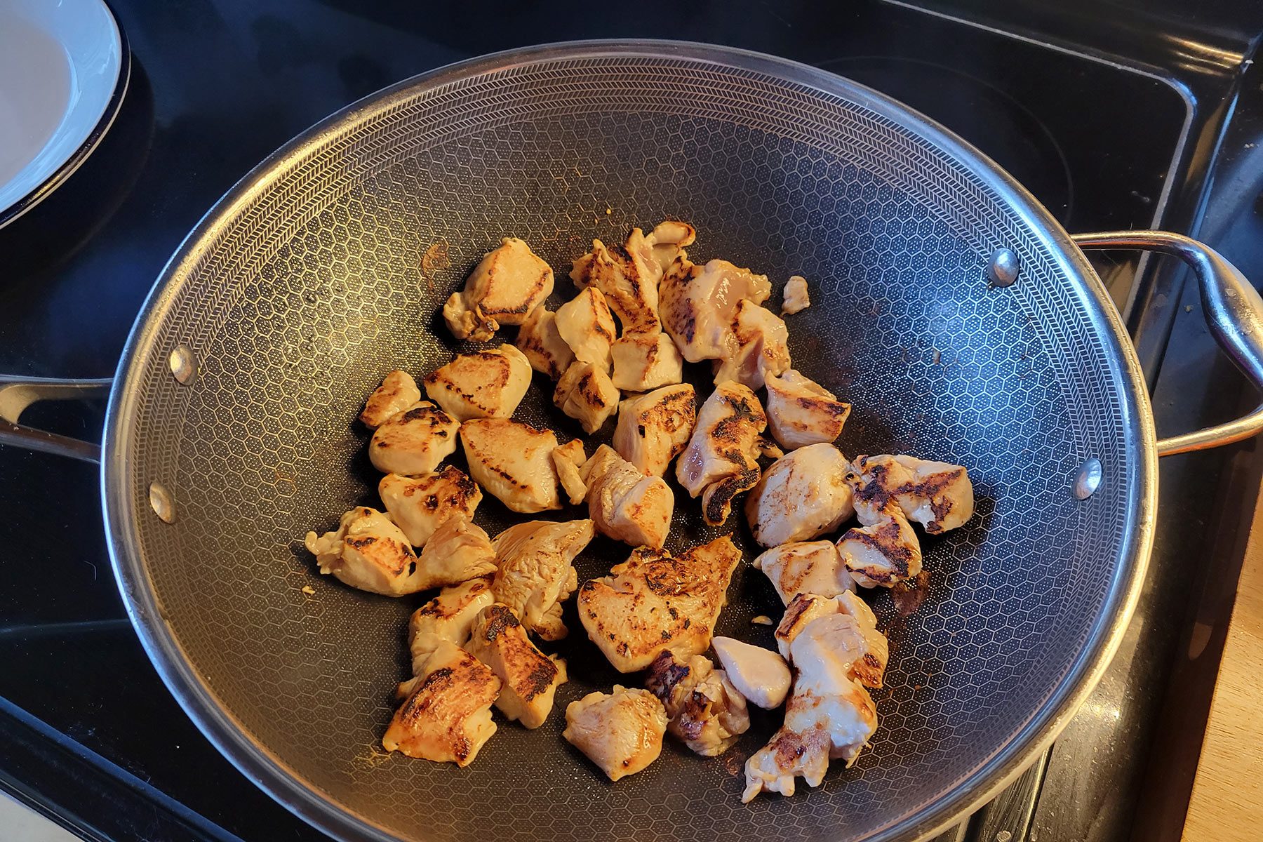 Review: I Tested the HexClad Wok That's Compatible With All