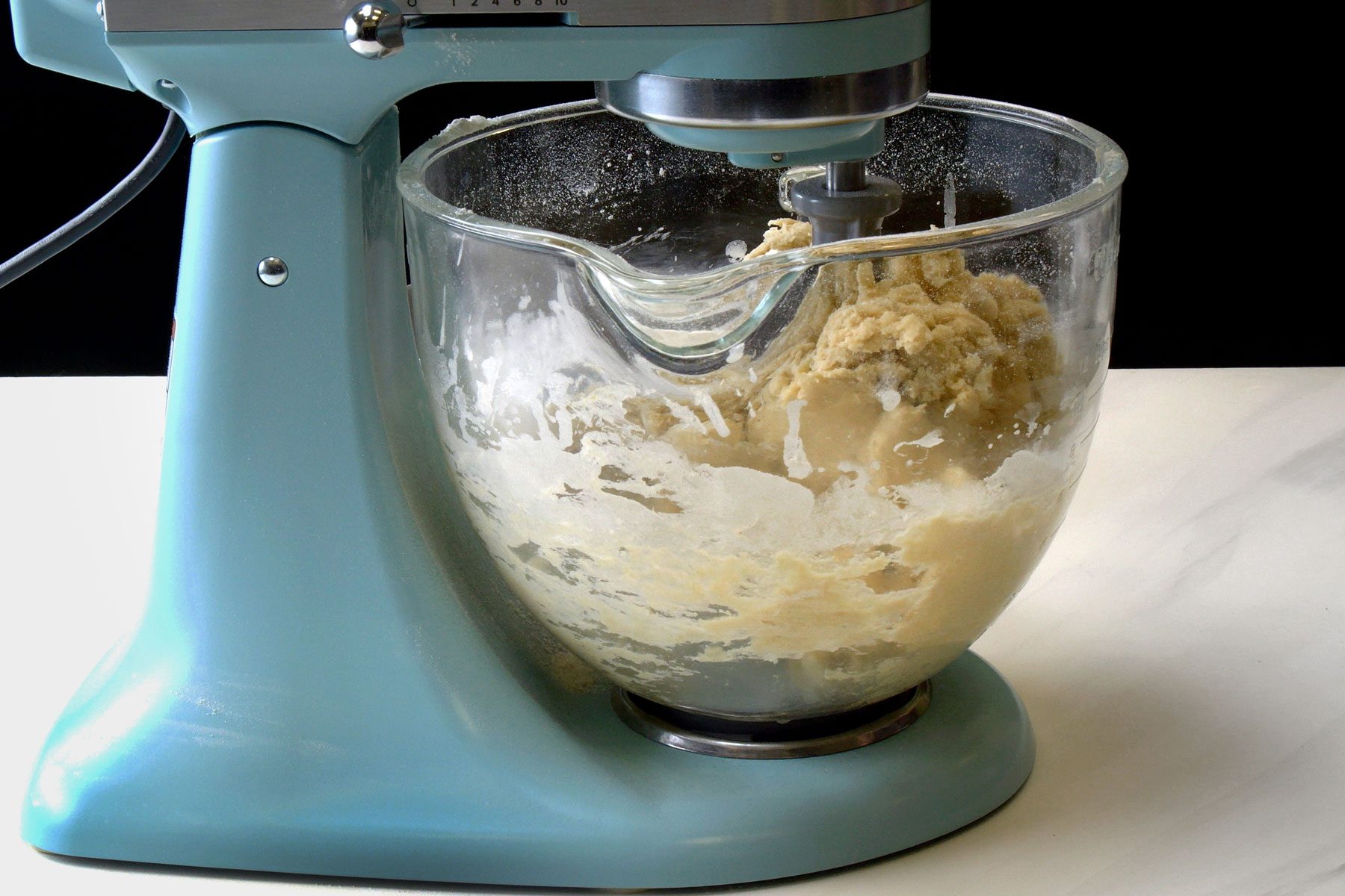 Mixing milk eggs and flour in a large bowl