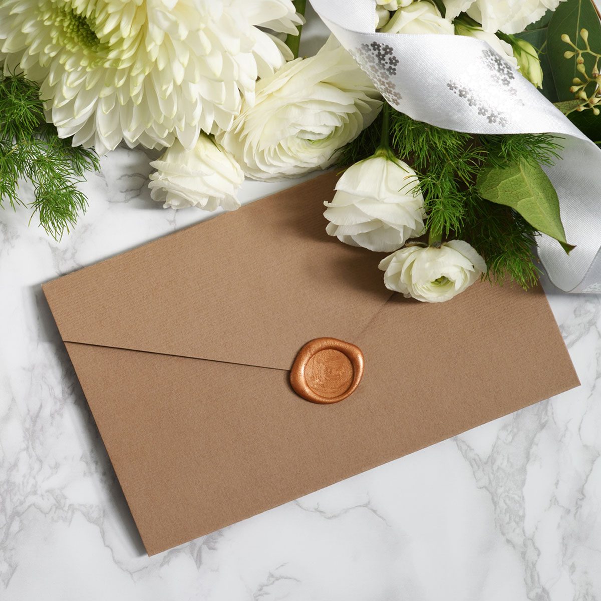 Beautiful Arrangement Of Envelope Ribbon And White Flowers