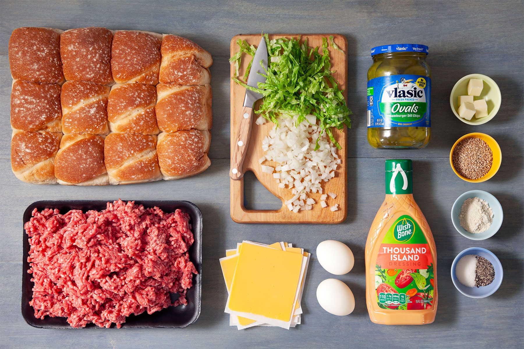 overhead shot of burger ingredients on marble