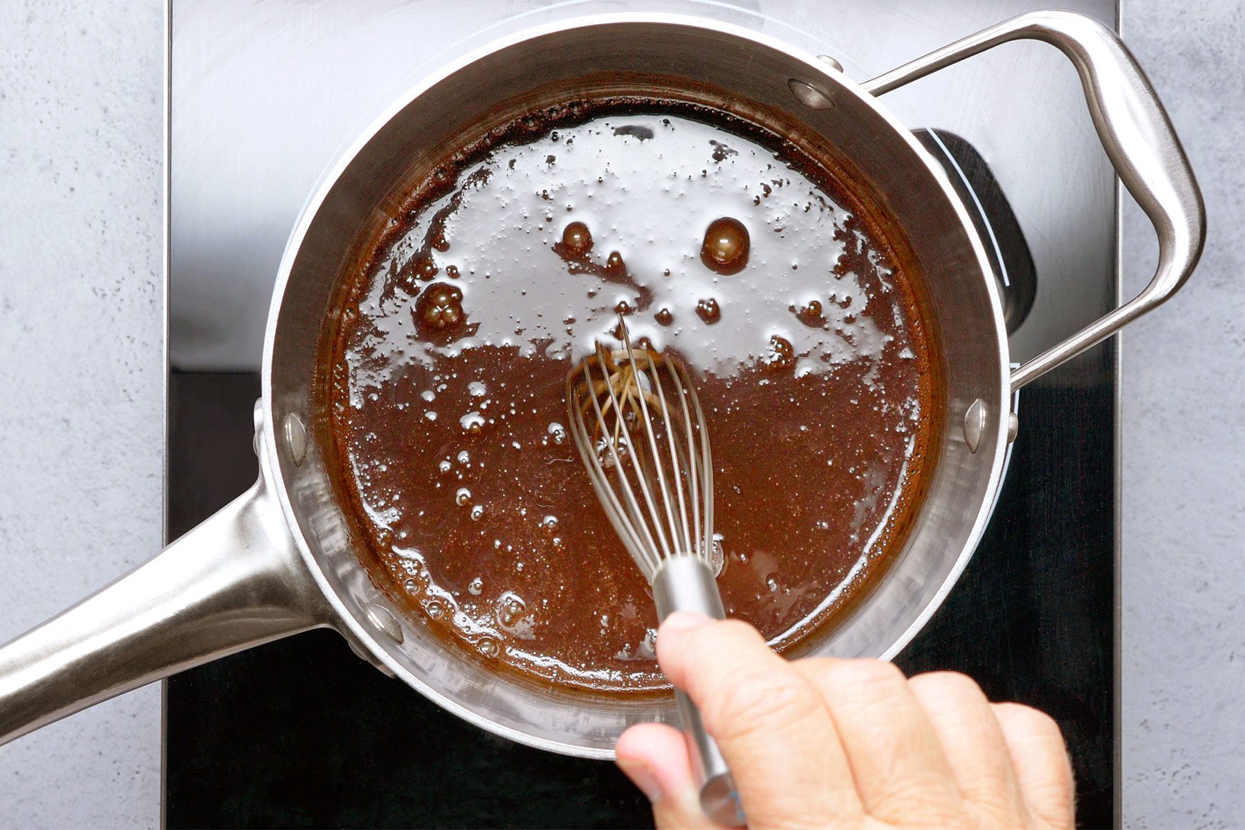 overhead shot of cocoa and sugar mix in a saucepan