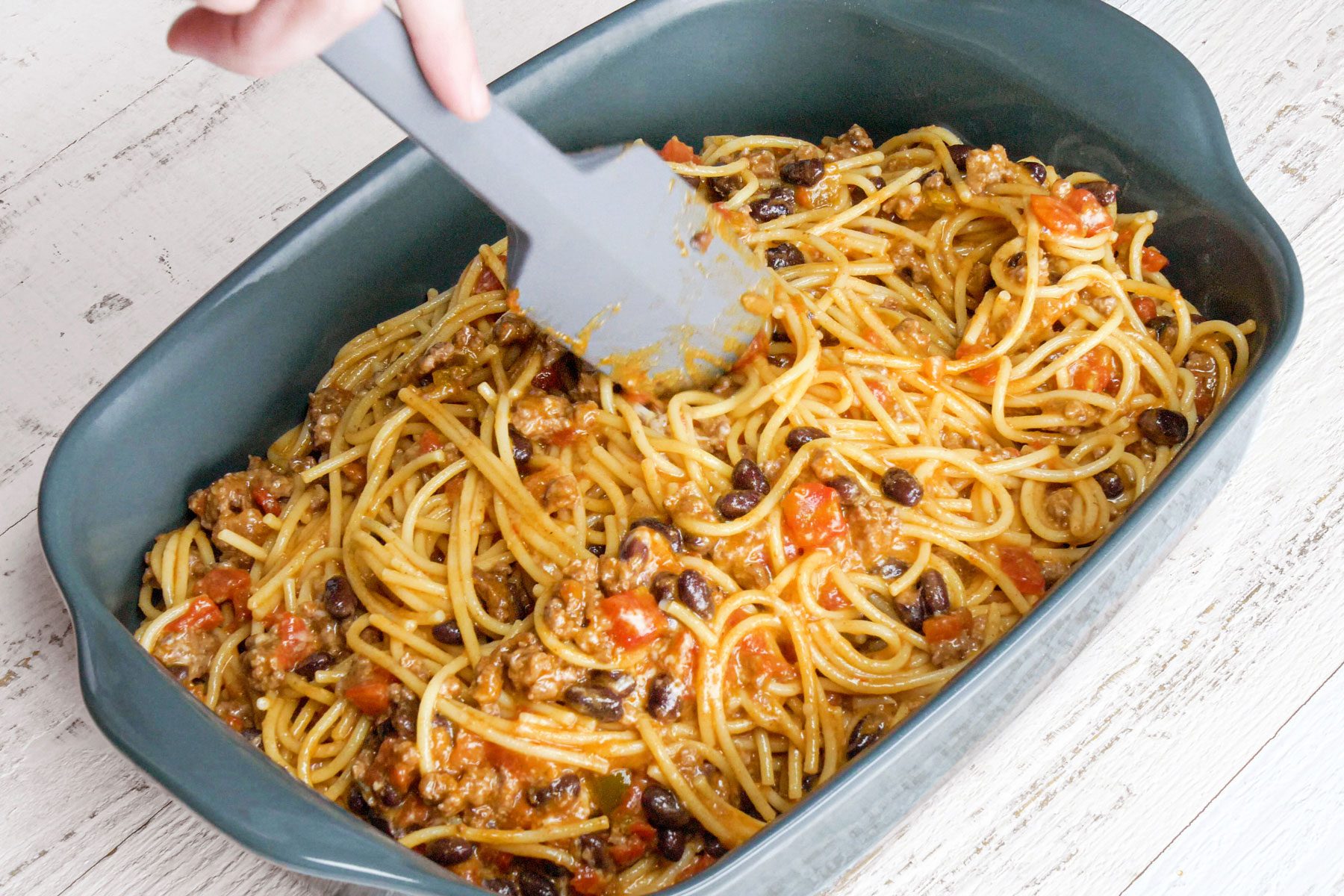 Taco Spaghetti in a baking tray on a wooden table