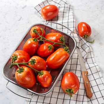 Fresh Tomatoes on White Marble