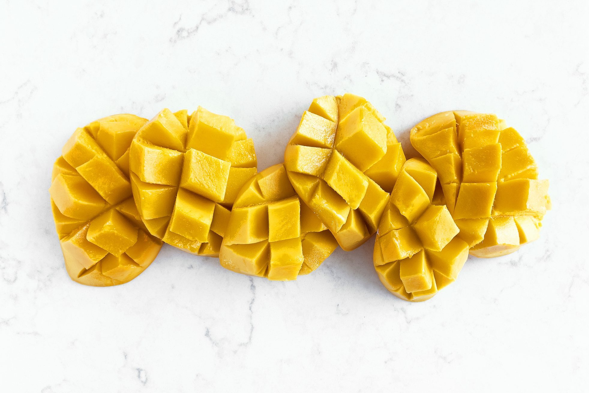 Sliced mango on white background