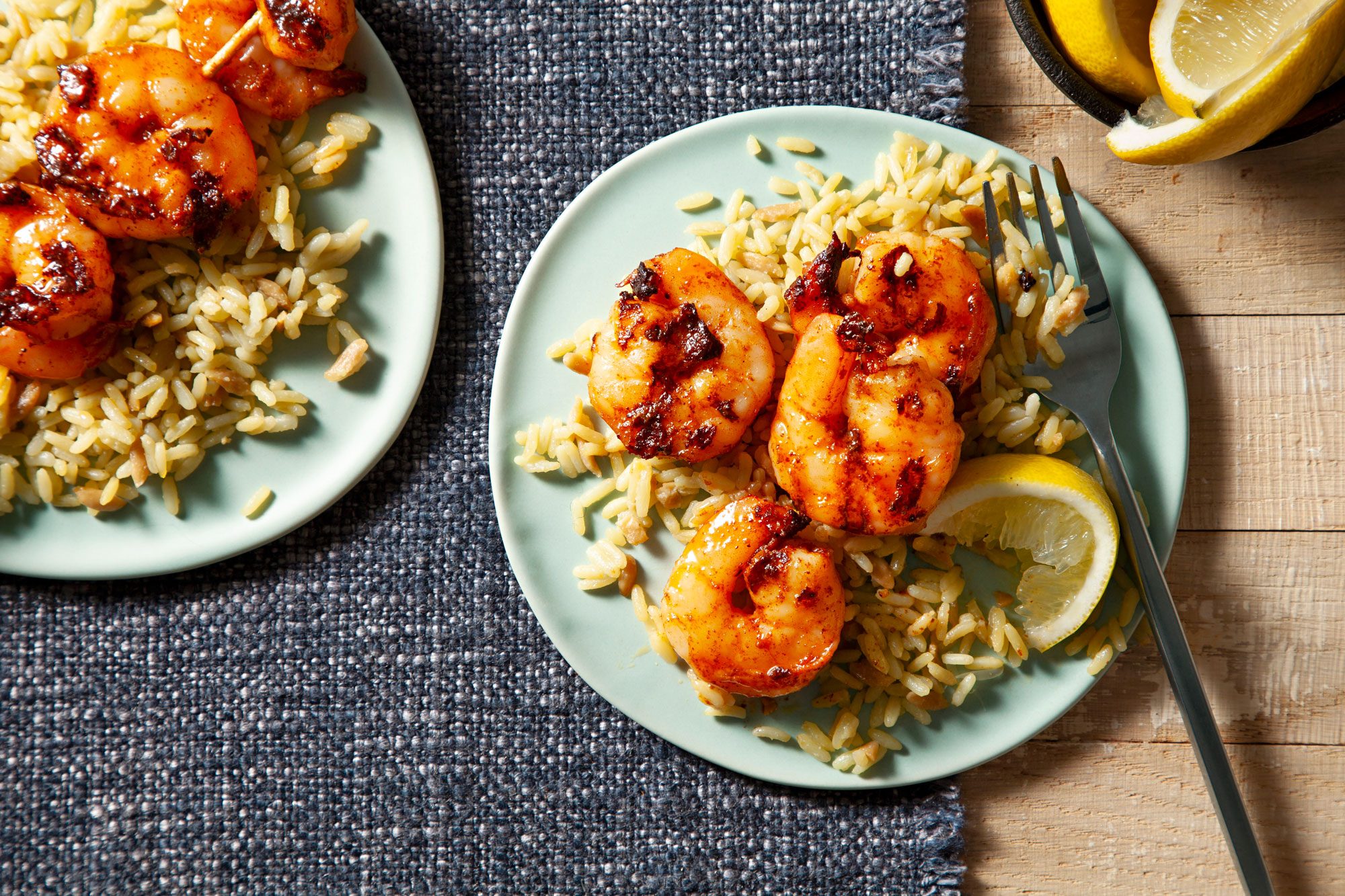 Buttery Grilled Shrimp served with rice and lemon on the side