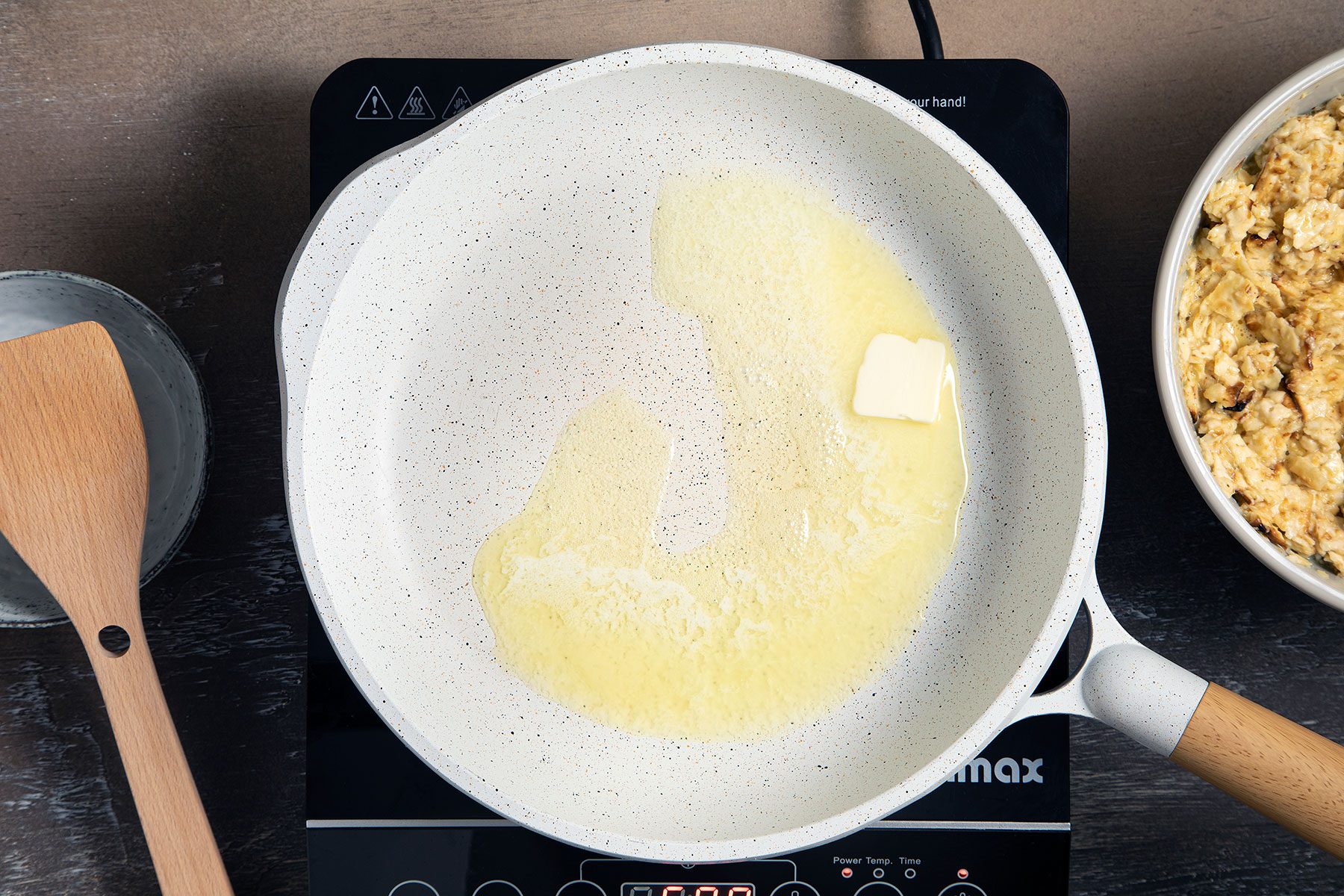 Melting butter in a pan over heat
