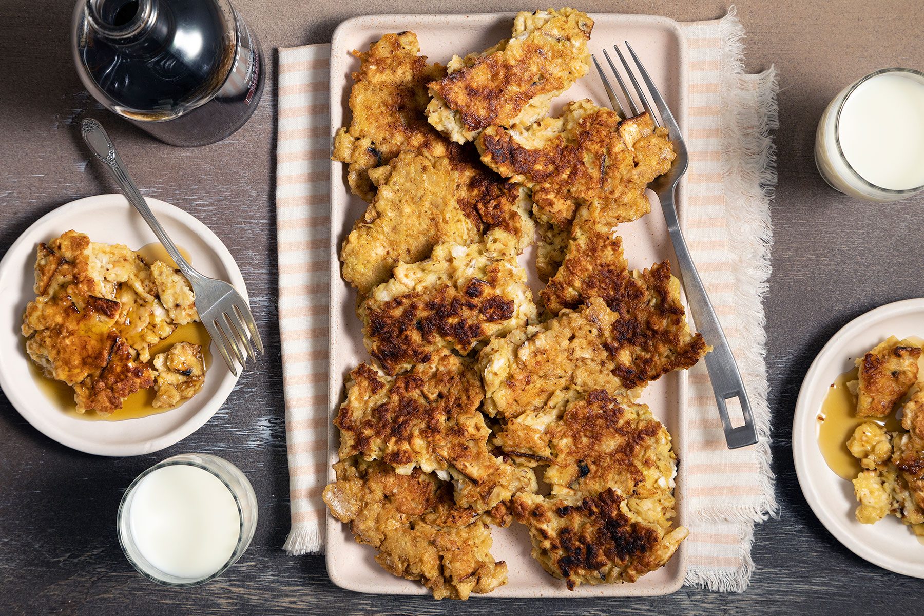 Cooked Matzo Brei served on plate with maple syrup