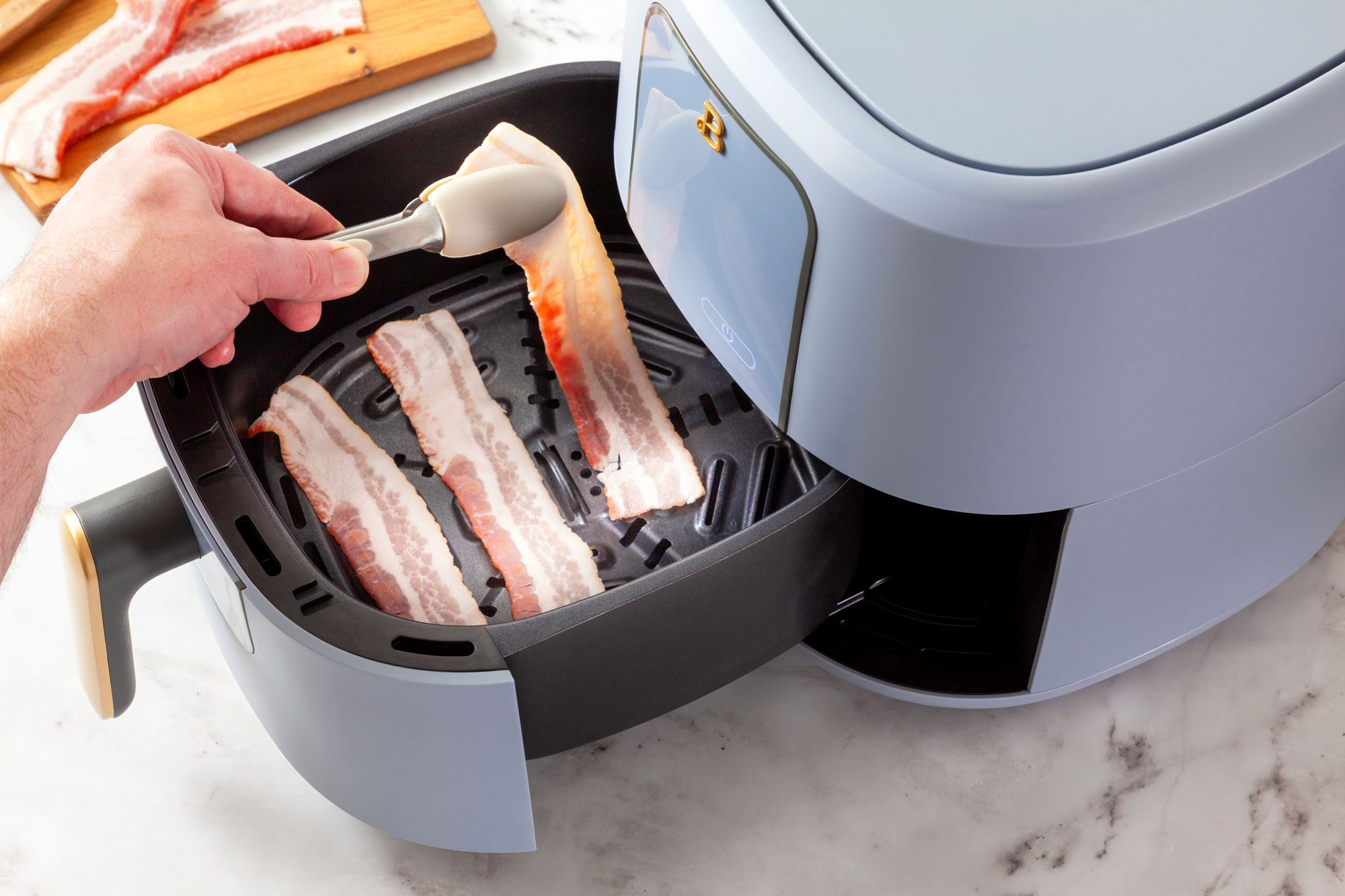Arrange the bacon in a single layer in the air fryer basket