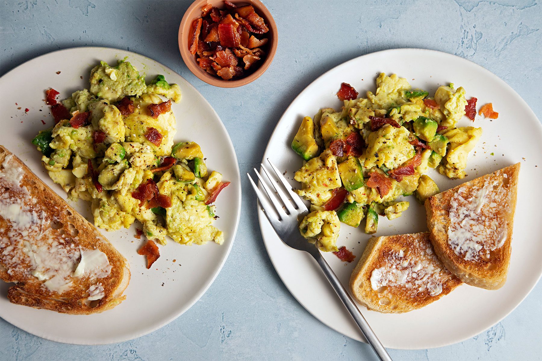 overhead shot of avocado scrambled egg served with toast
