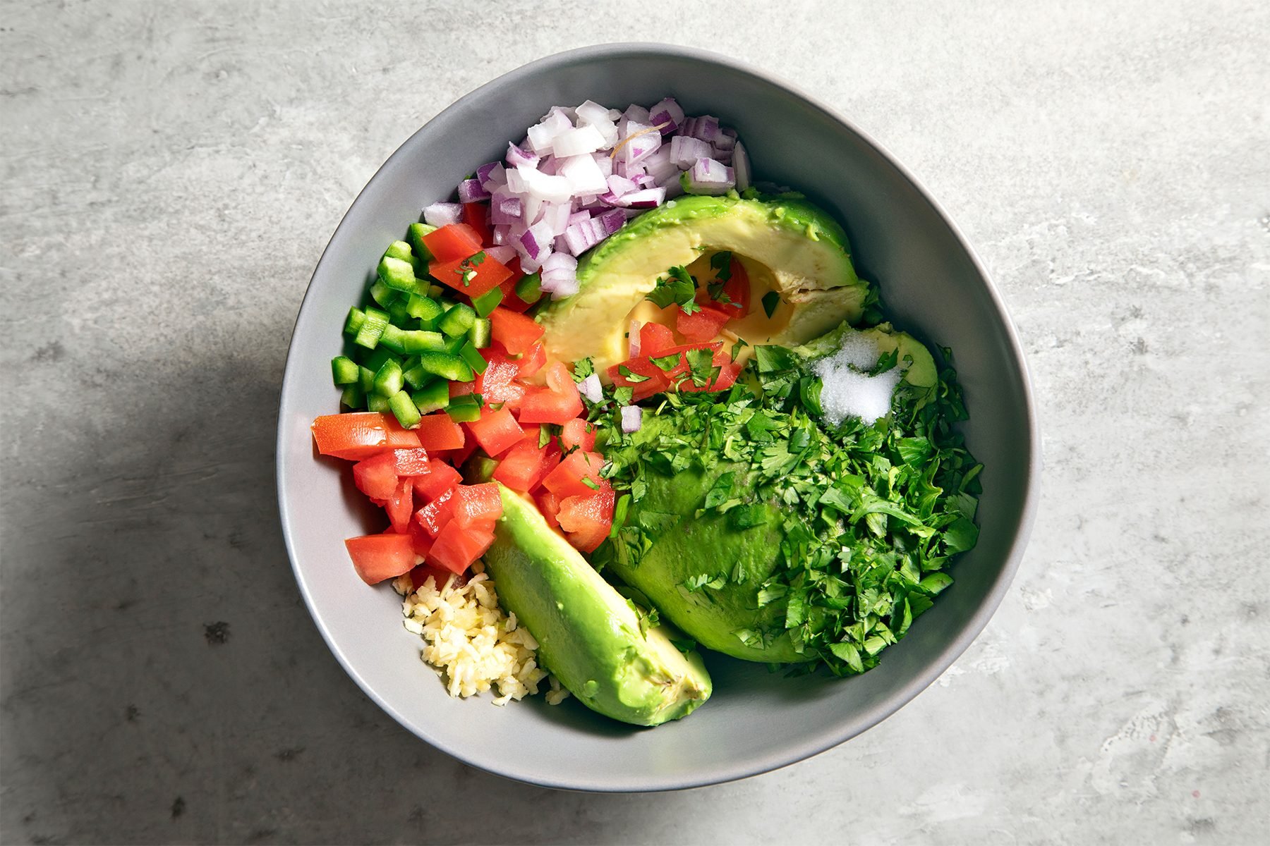 Ingredients of Easy Guacamole in bowl