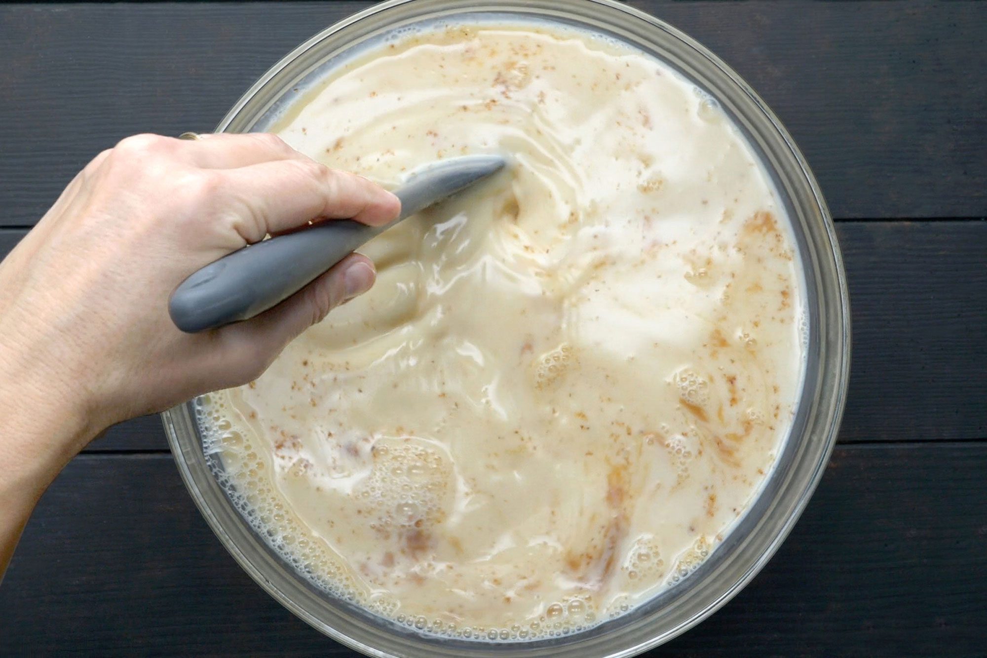overhead shot of Stir in vanilla, nutmeg and milk in egg mix