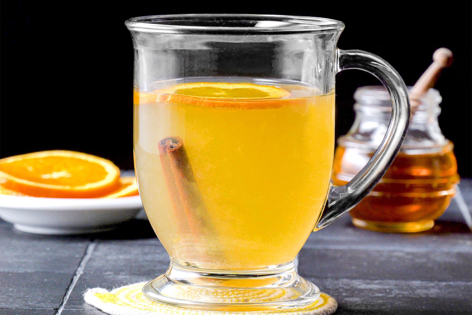 Hot Toddy served in large mug with cinnamon stick