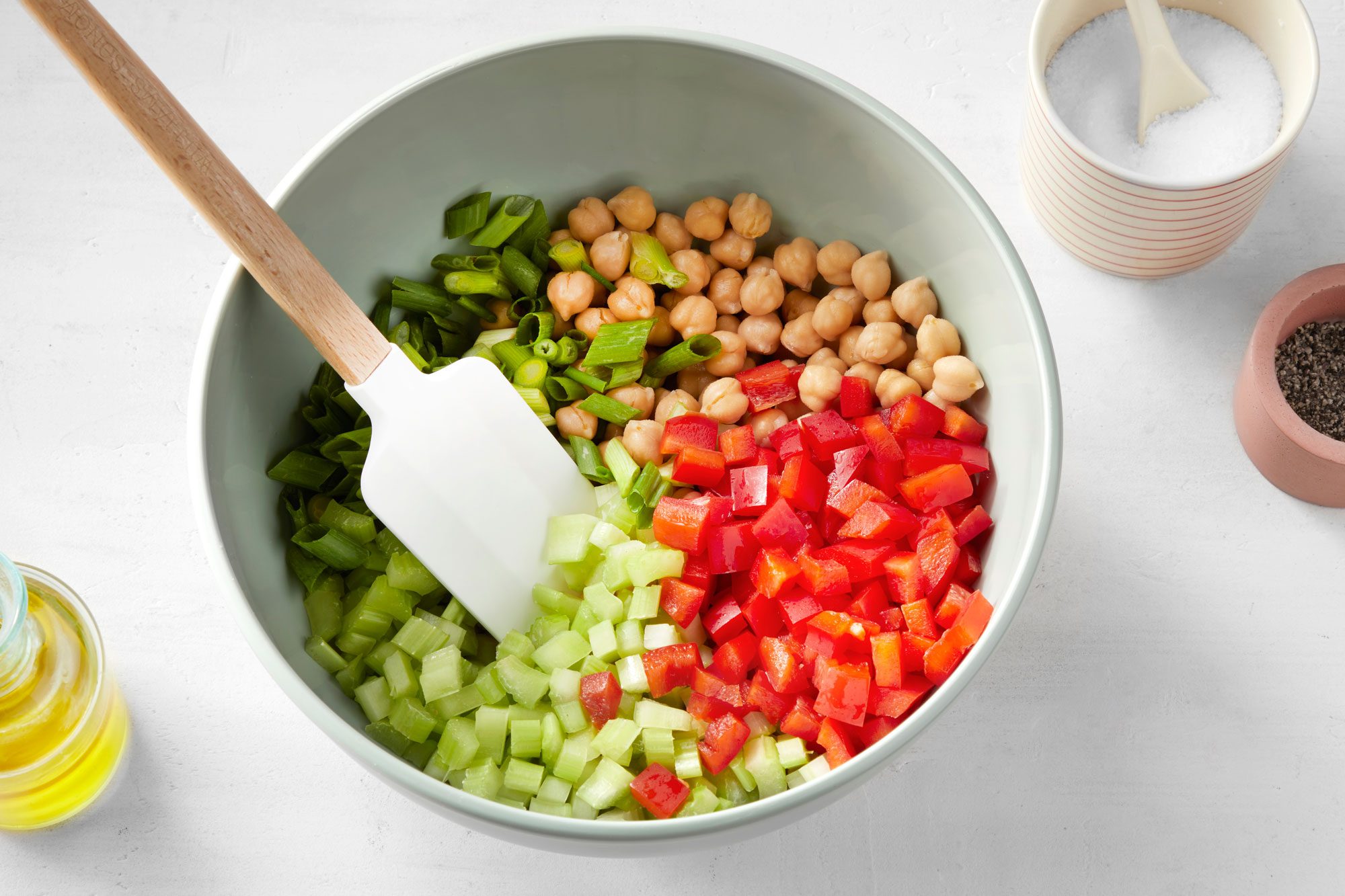 Combine the chickpeas, celery, red pepper and green onions in a large bowl