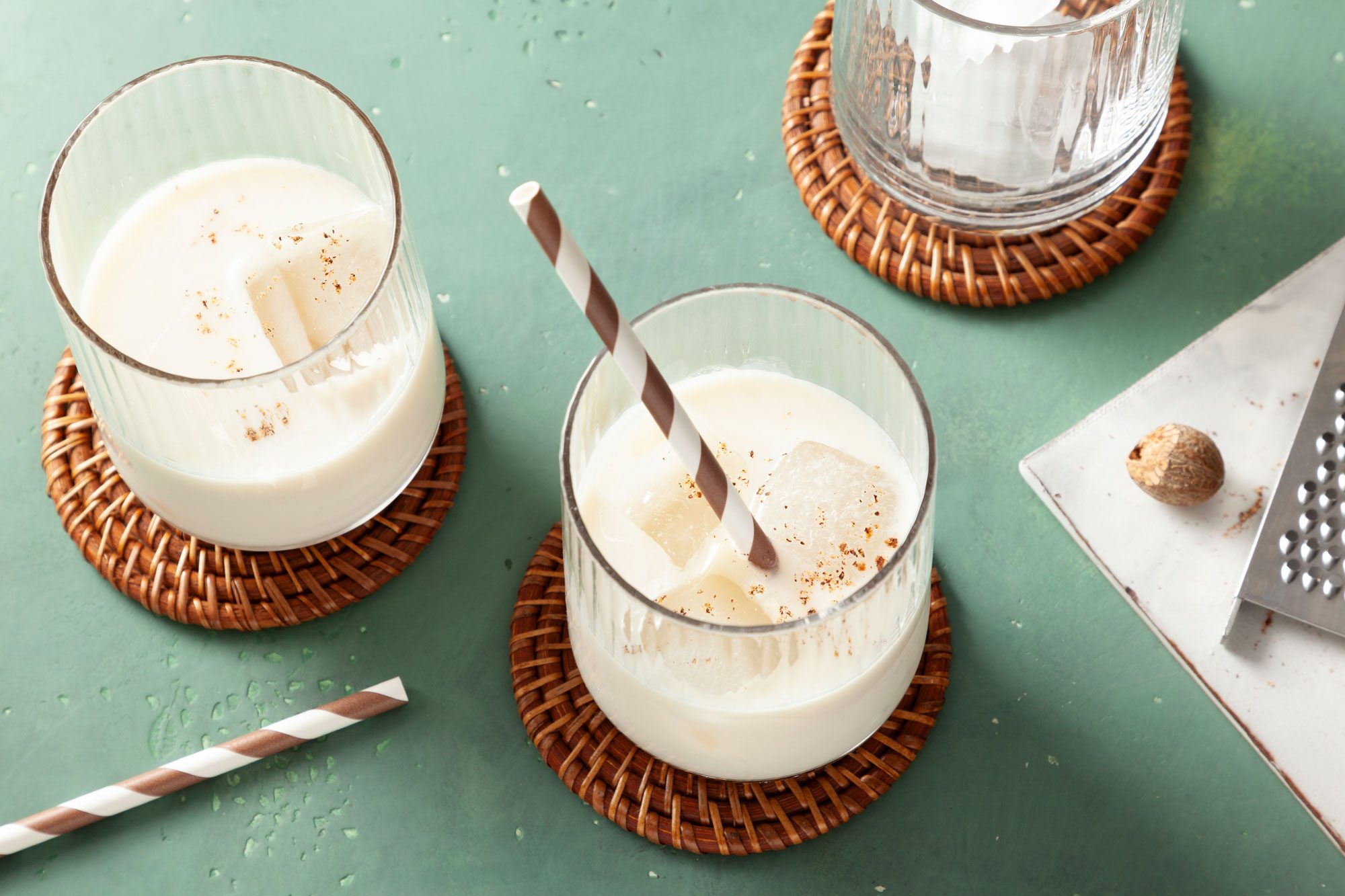 Milk Punch served in two glasses with a straw