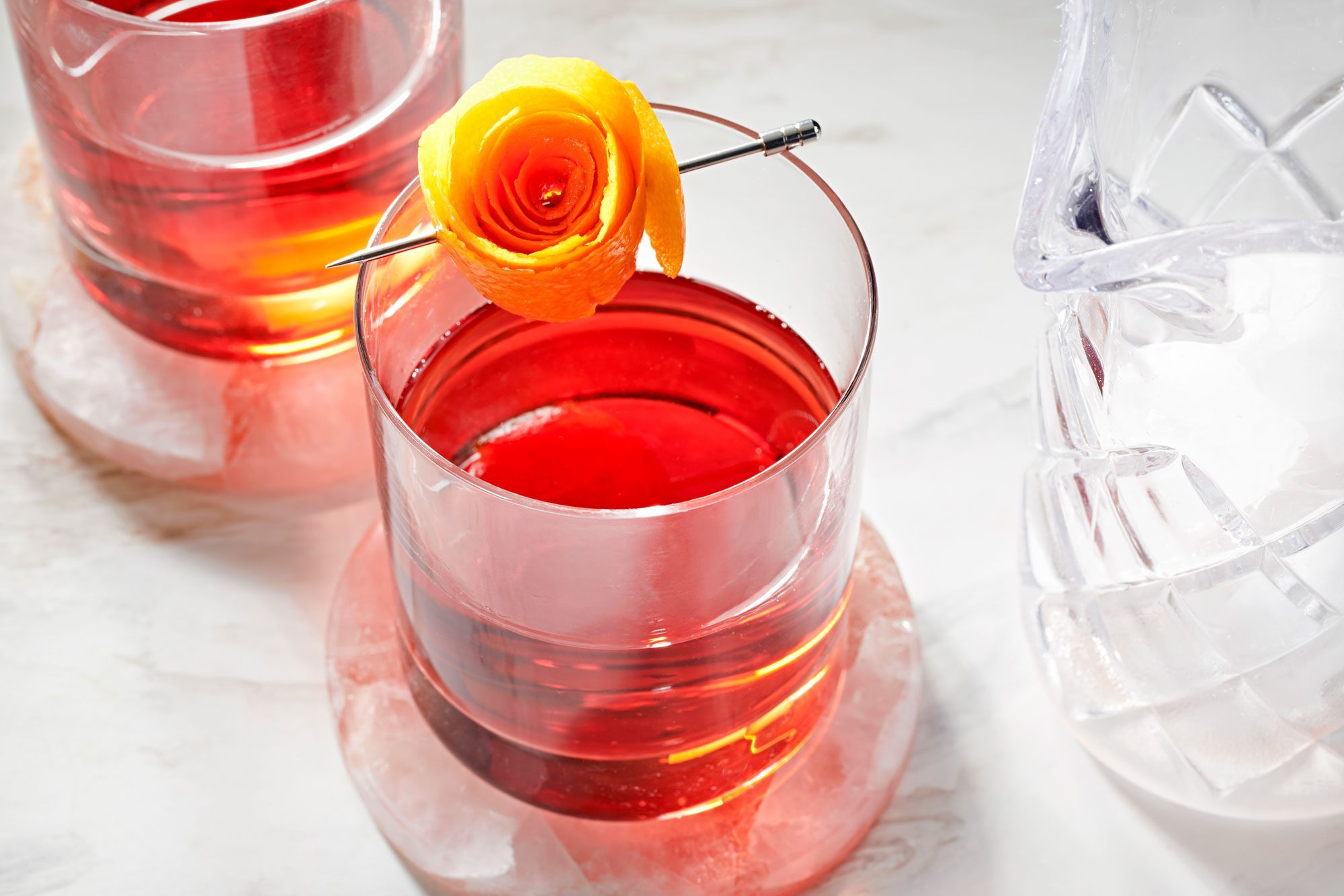 negroni served in a rock glass; marble surface;