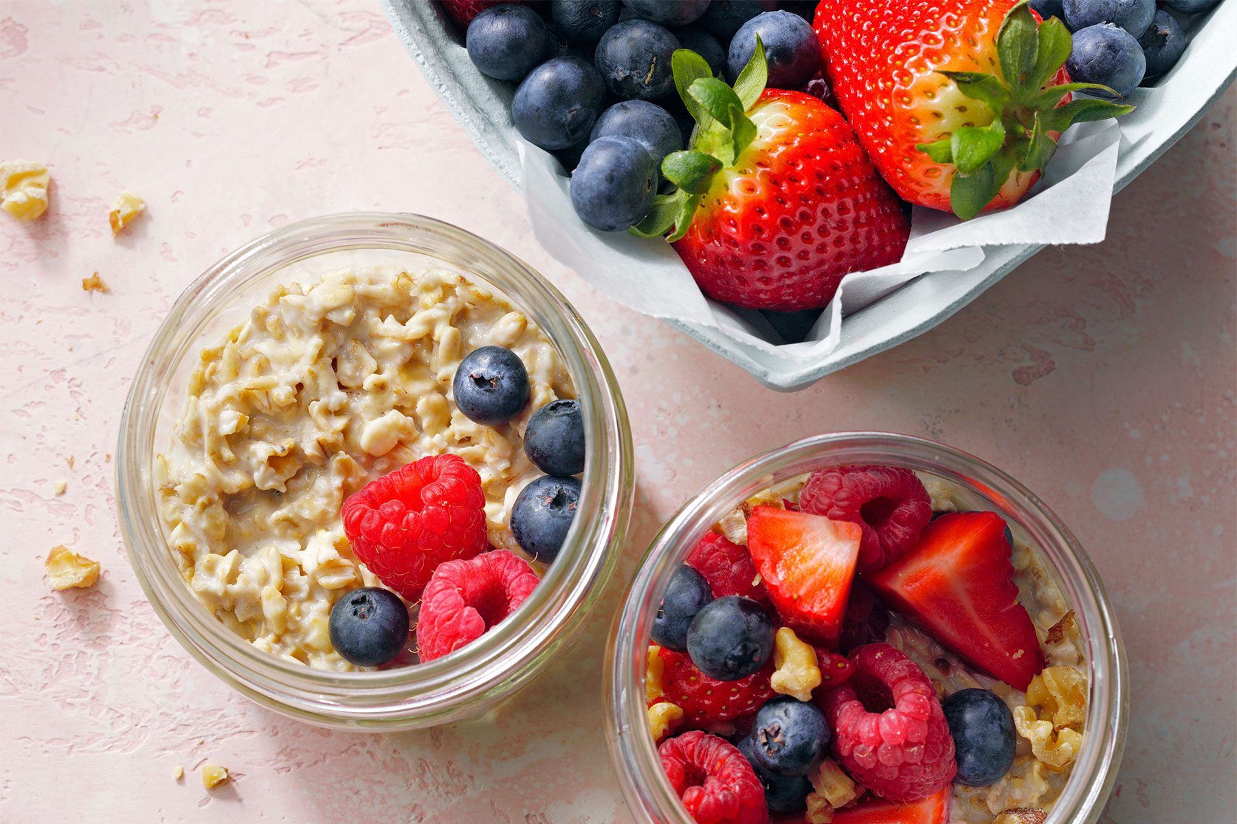 overhead shot of oatmeal topped with fruits and nuts