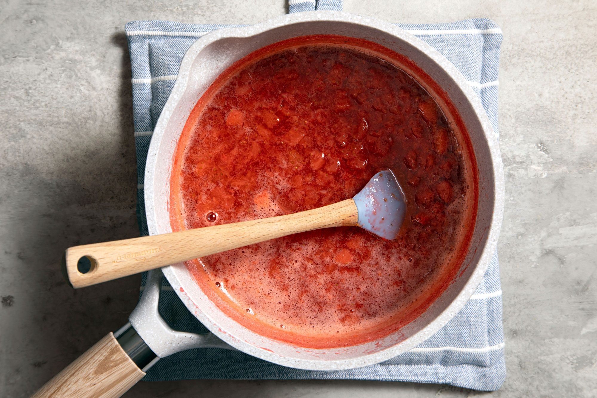 Whisk diced strawberries, sugar, water, lemon zest and lemon juice in a medium saucepan