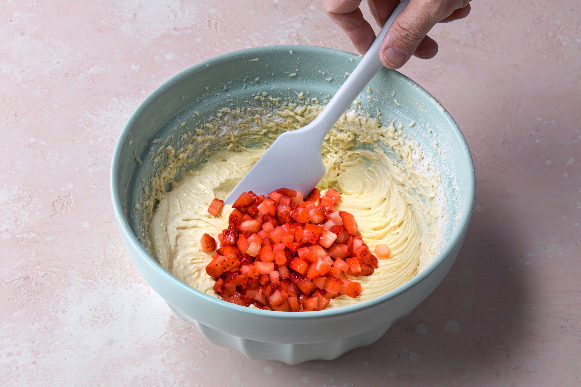 Fold in the diced strawberries with the mixture