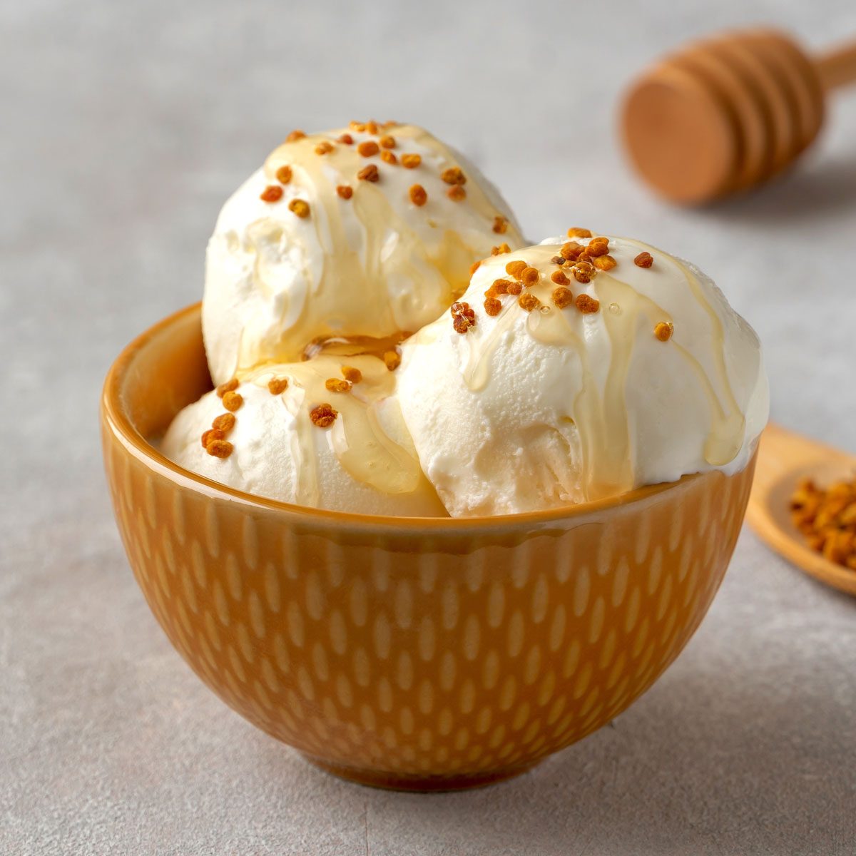 Tasty Vanilla Ice Cream With Bee Pollen And Honey In Bowl