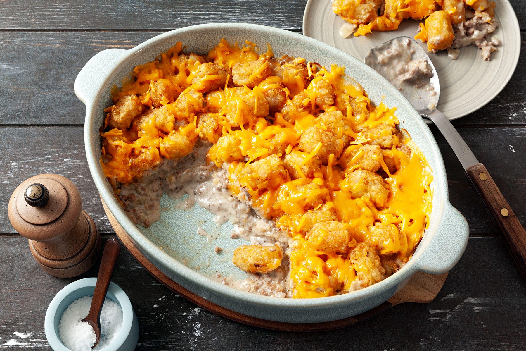 Cooked Tater Tot Casserole on wooden surface