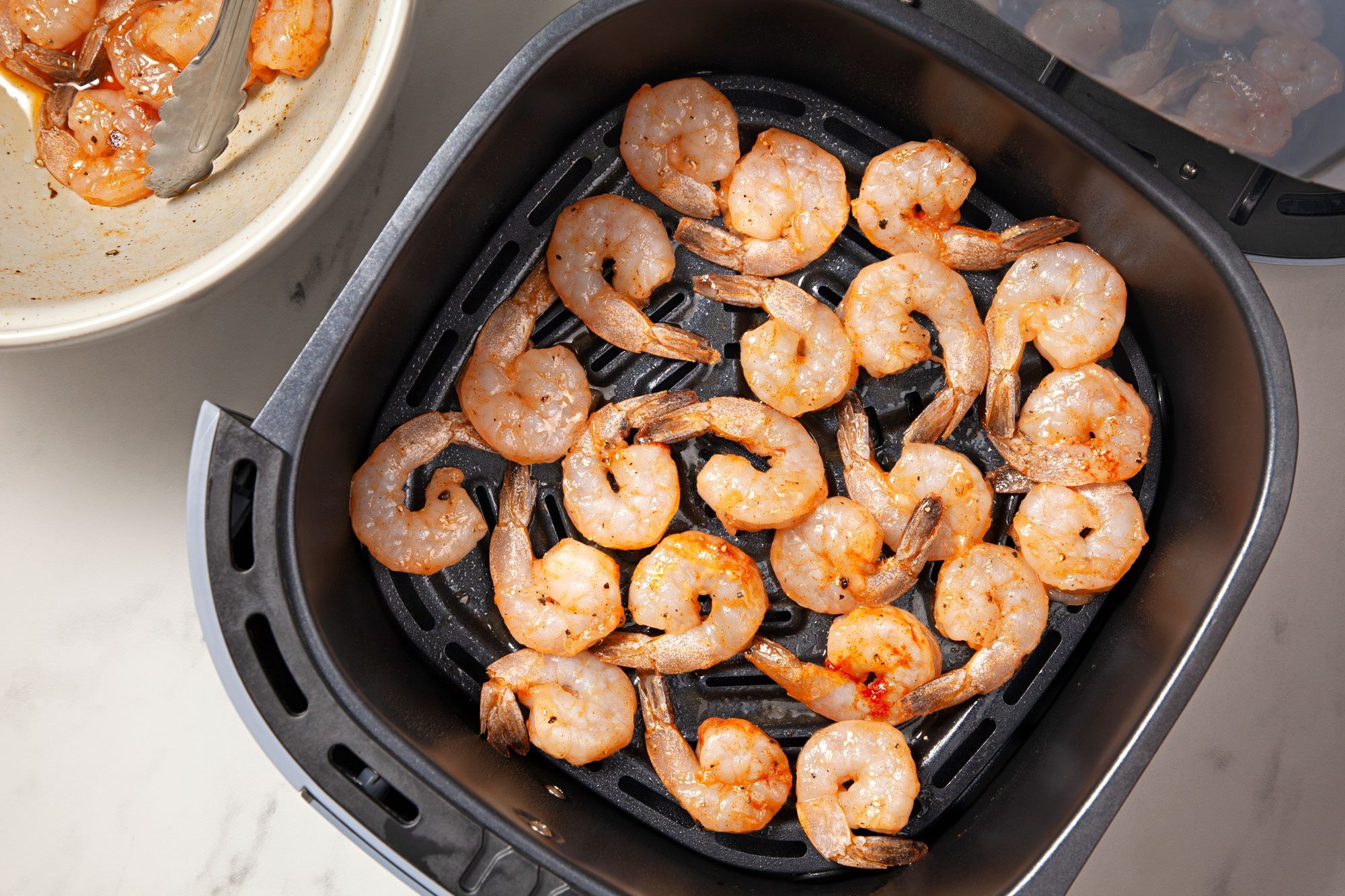 Arrange shrimp in a single layer in greased air fryer