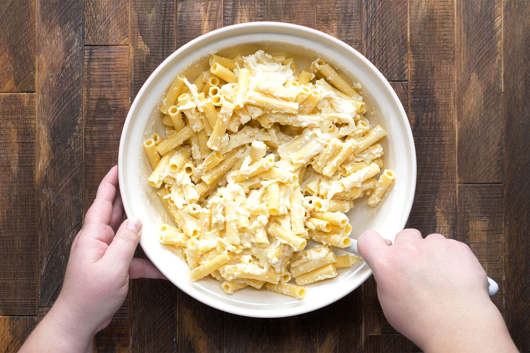 overhead shot of cheese mixture blended in pasta