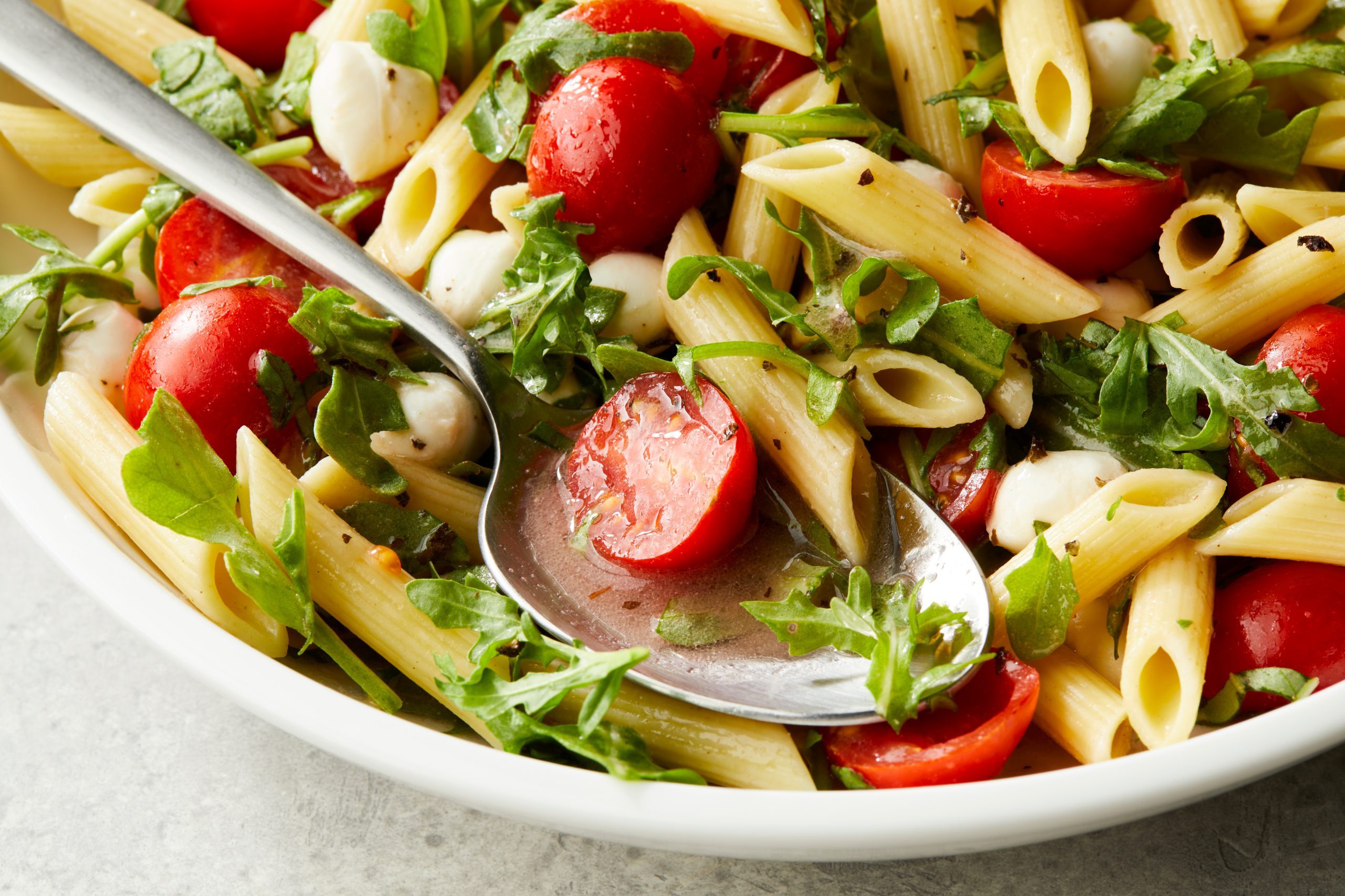 Basil Vinaigrette drizzled over a bowl of salad