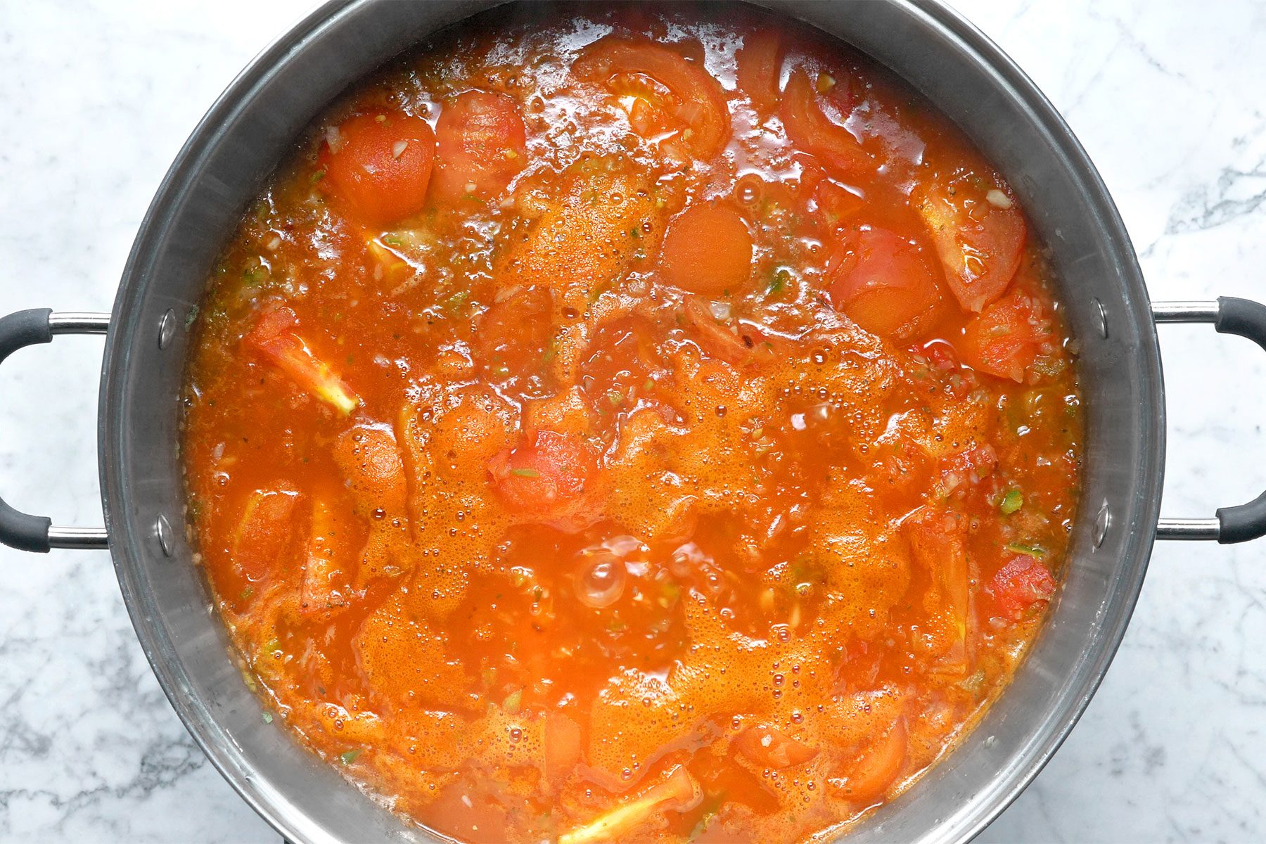 Overhead shot of add water to cover; bring to a boil; marble background;