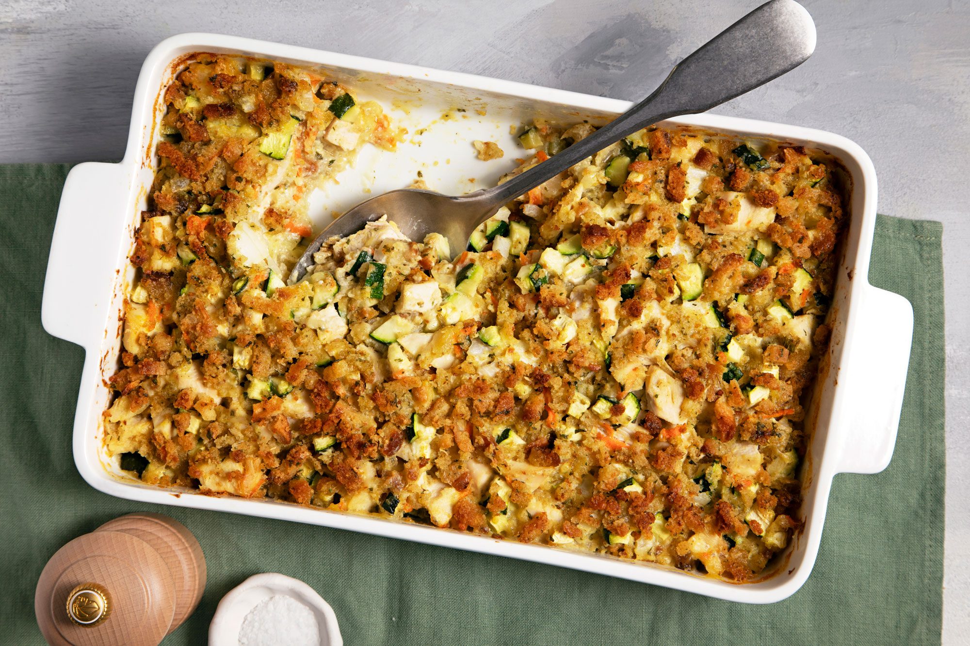 overhead shot of chicken zucchini casserole in a baking dish