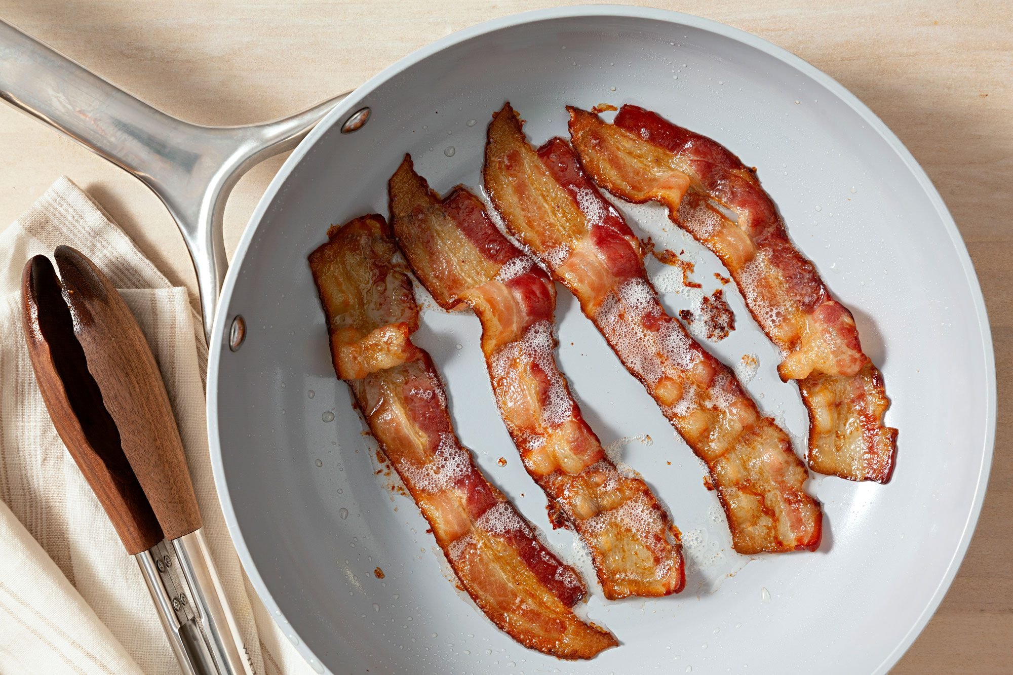 Cook the bacon over medium heat until it’s crisp in a large skillet