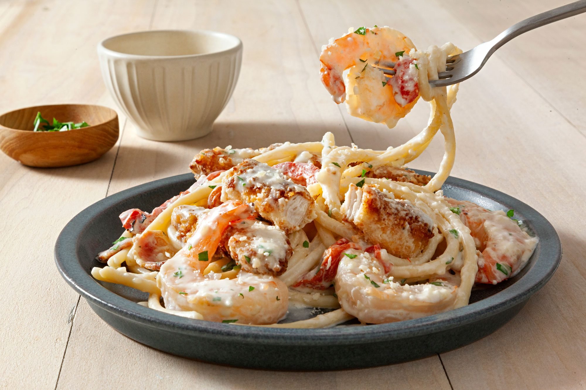 Delicious Copycat Olive Garden Chicken And Shrimp Carbonara served in a plate