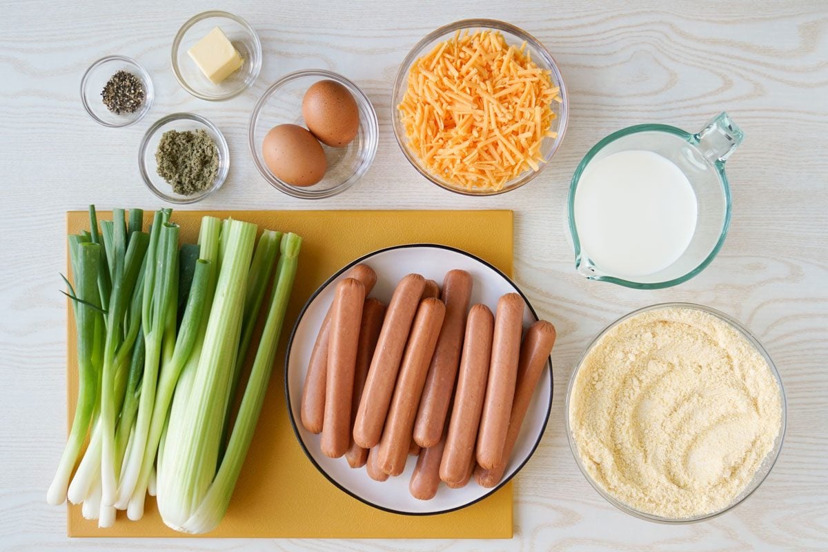 Corn Dog Casserole ingredients: Hot Dog, Milk, Cheese, Green Onion, Eggs, Pepper, Butter