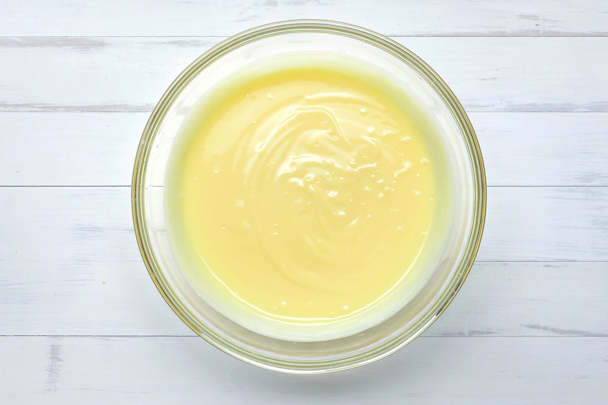 overhead shot; white background; In a large bowl, cream cheese;