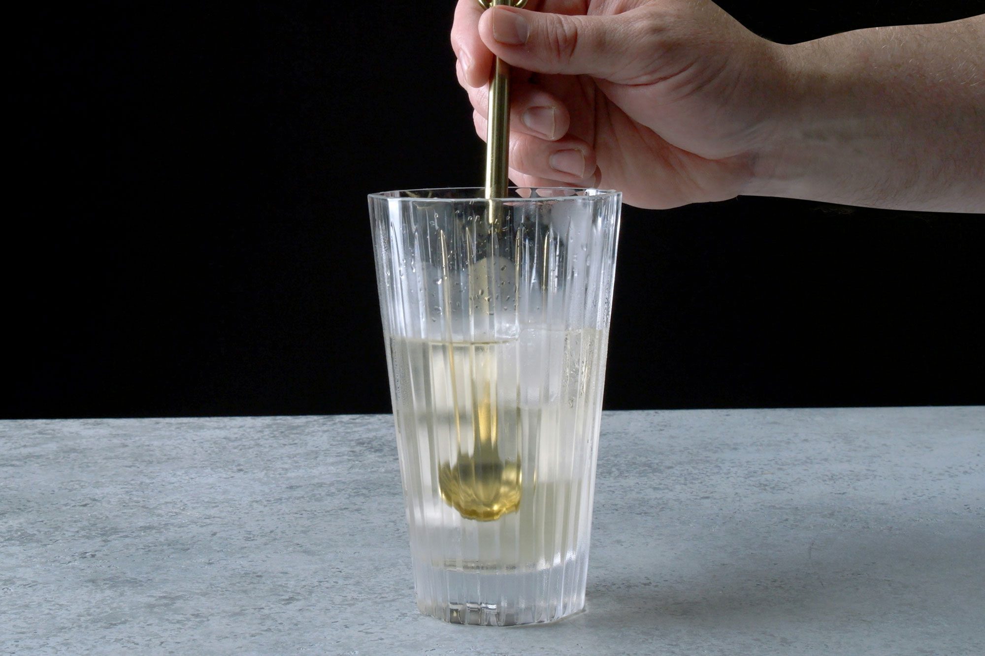 table view shot of same glass; stir until chilled; grey background;