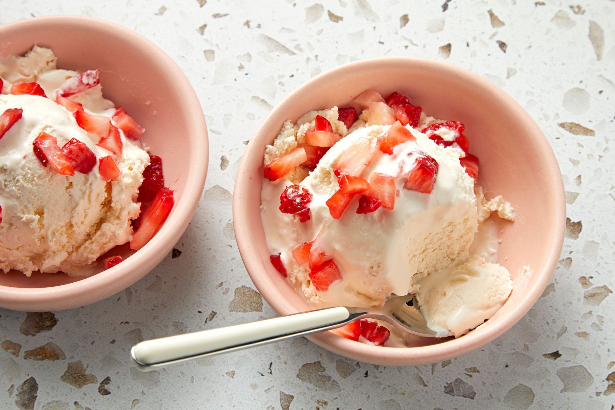 Two bowls of Keto Ice Cream garnished with strawberries