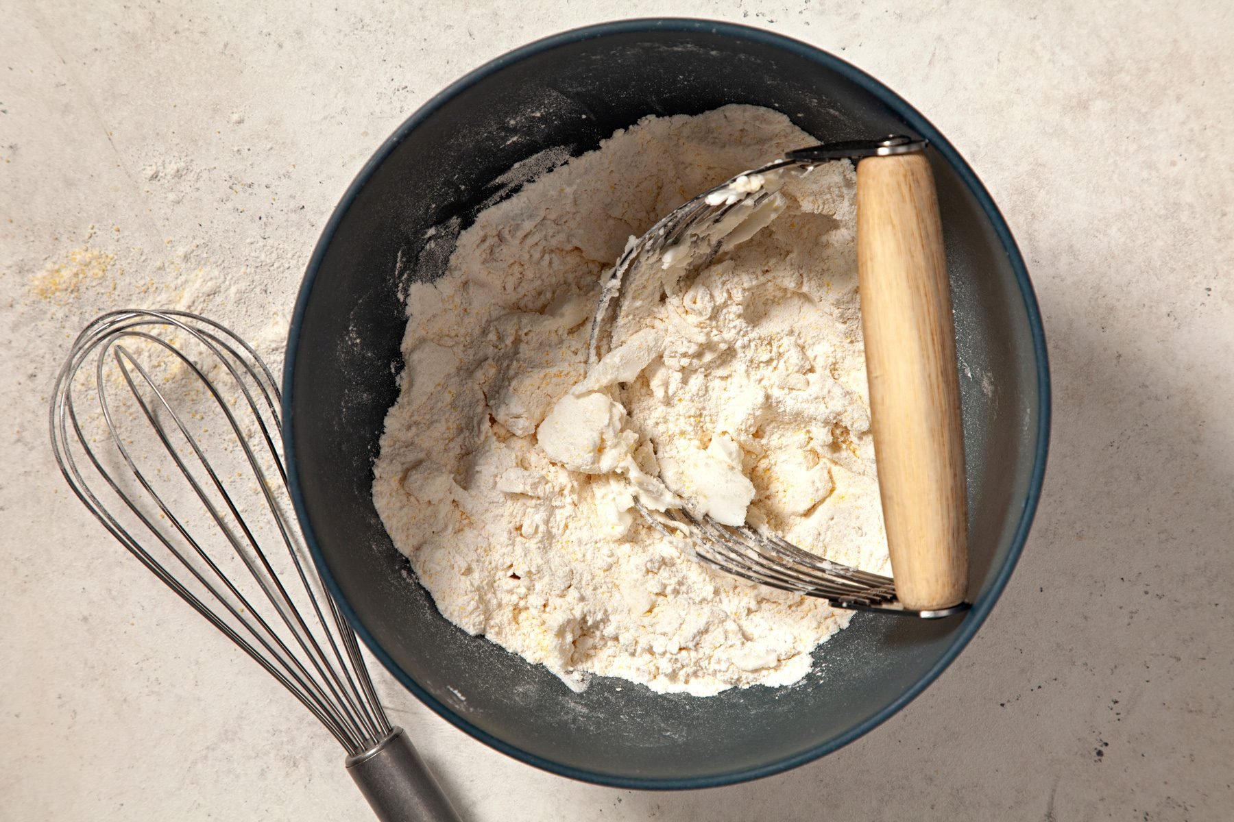 A ball with a mixture of flour, cornmeal, baking powder, salt and onion powder