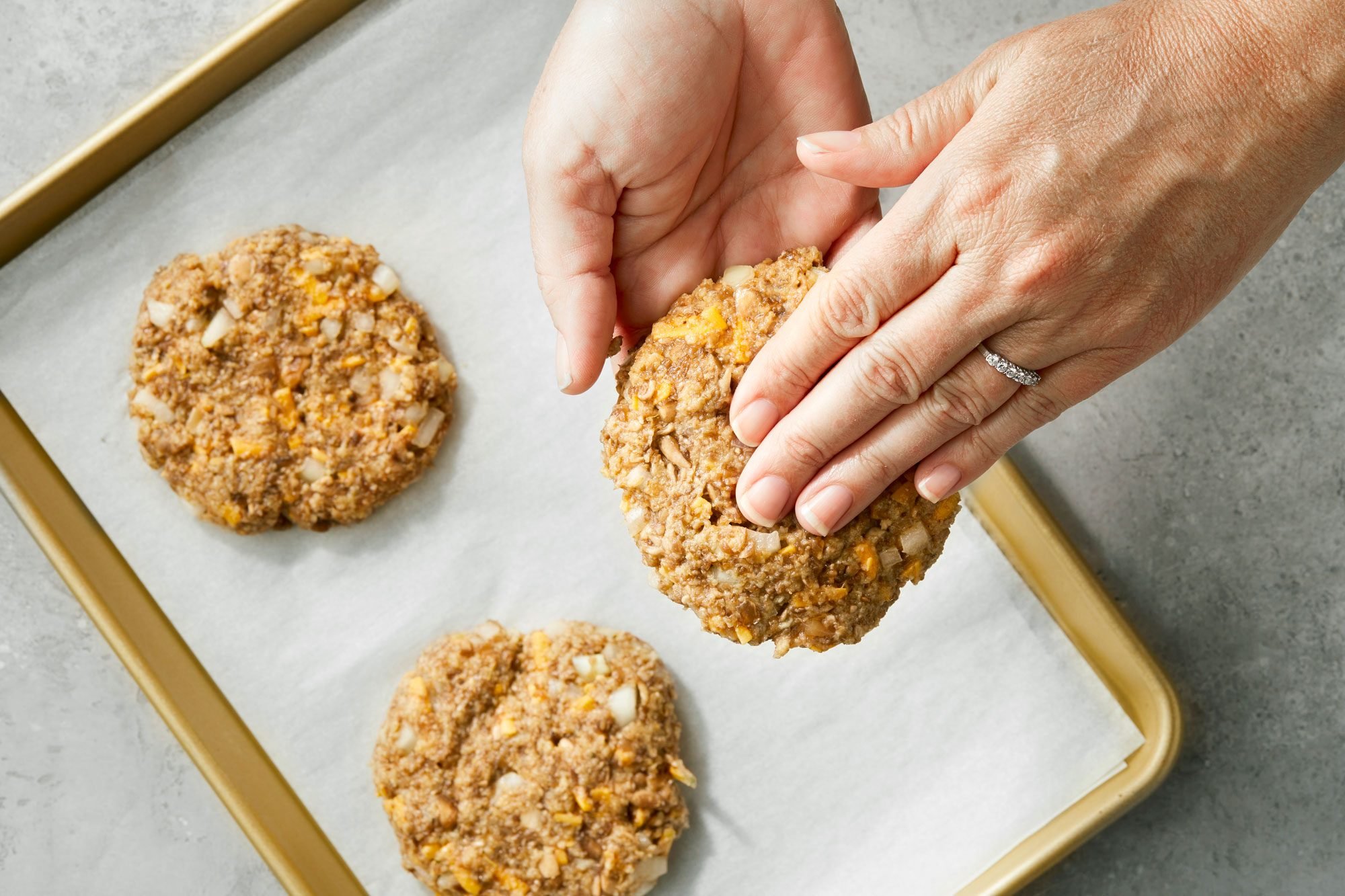 overhead shot; grey background; Shaping into patties;