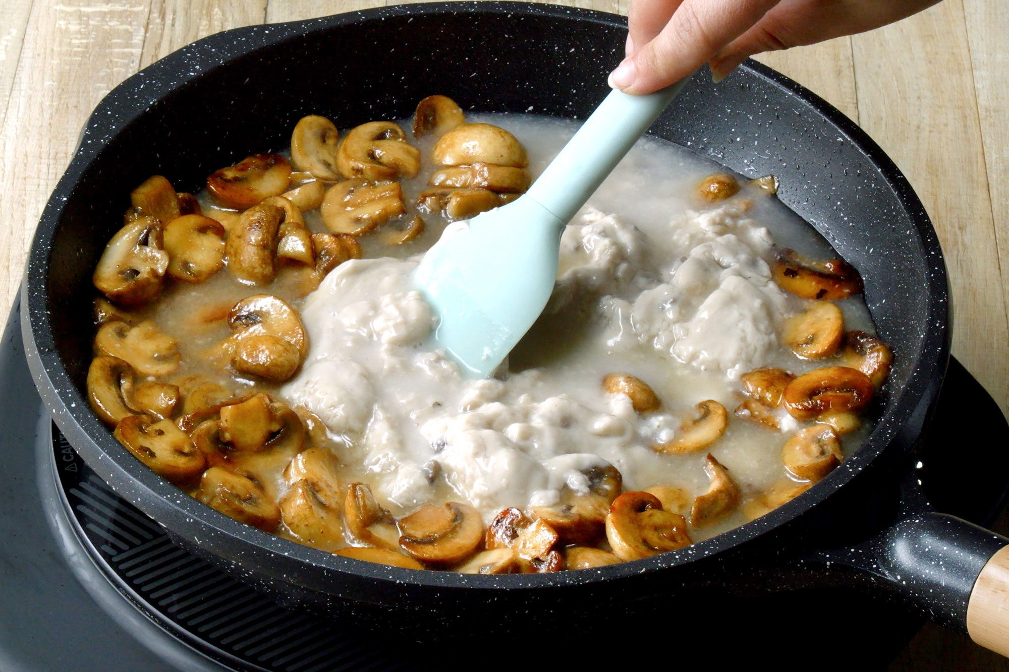 Combine the cream of mushroom soup and water in a microwave-safe bowl