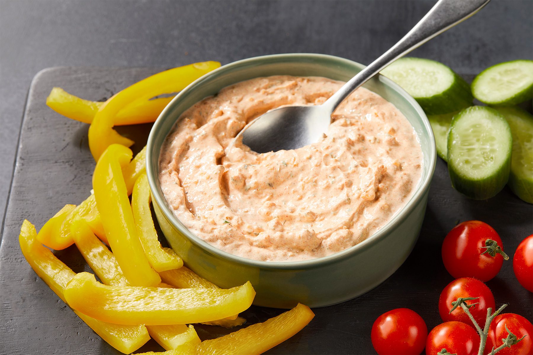 Ranch Dressing and Dip Mix in a bowl with silver spoon and veggies